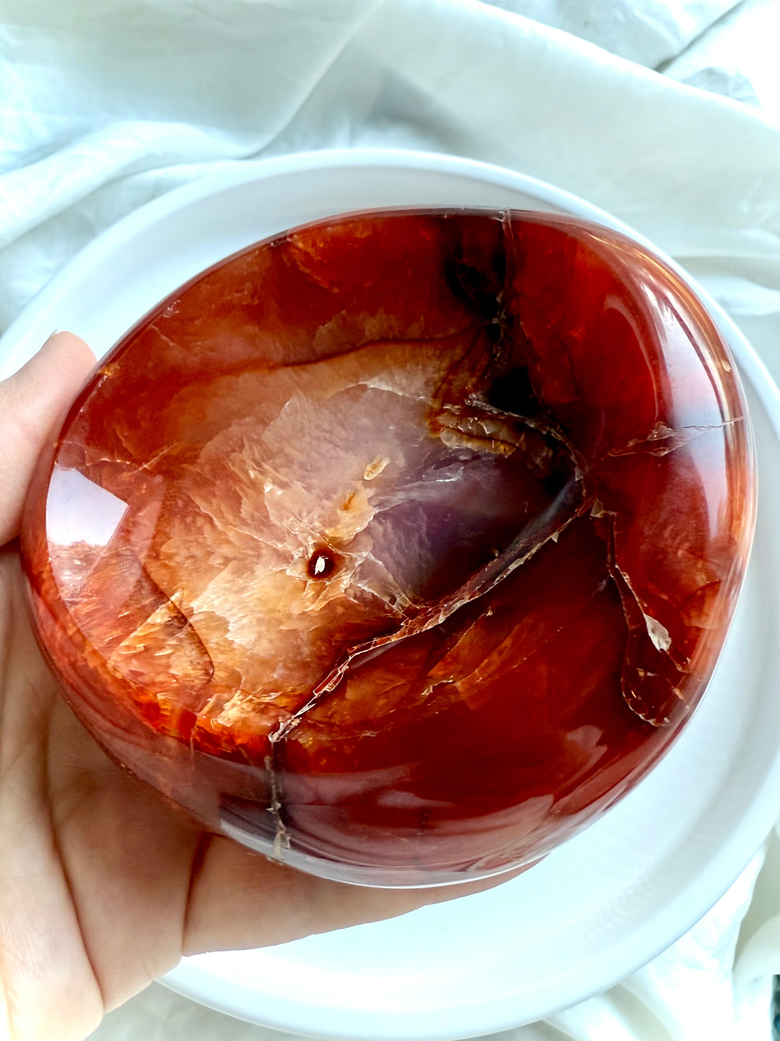 Polished Carnelian crystal bowl with fiery red and orange bands, hand-carved gemstone dish for vitality and creativity