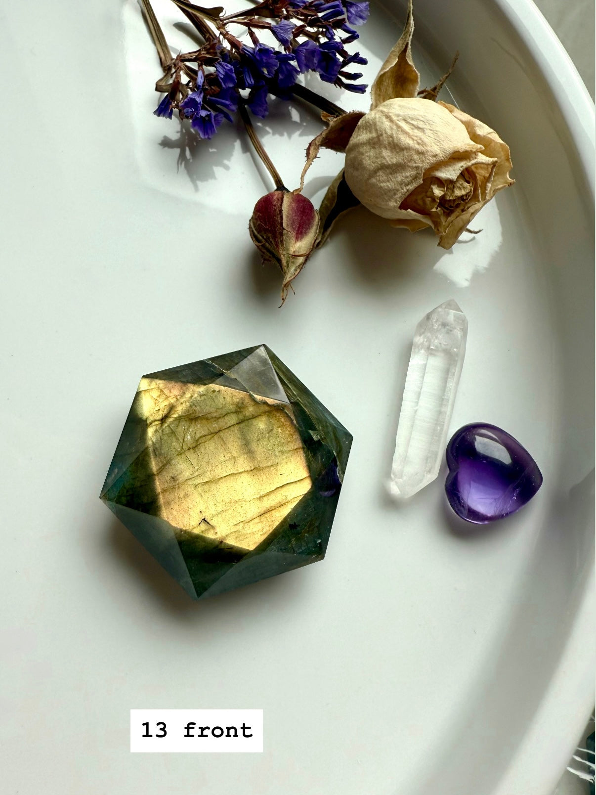 Labradorite hexagon gemstone with rainbow flash styled with amethyst, quartz, and dried florals