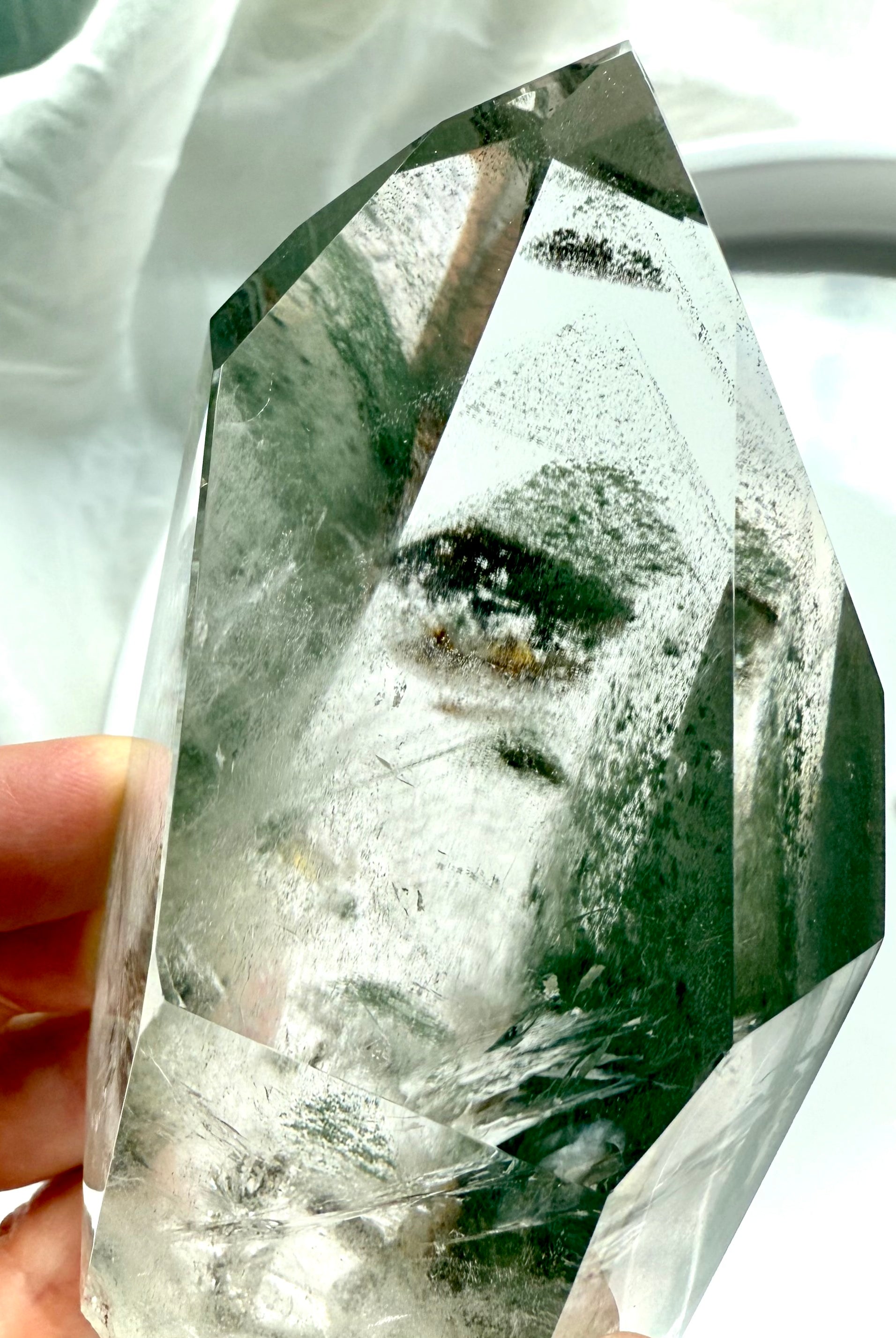 Polished Lodolite crystal point with layered chlorite phantoms and mossy landscape inclusions