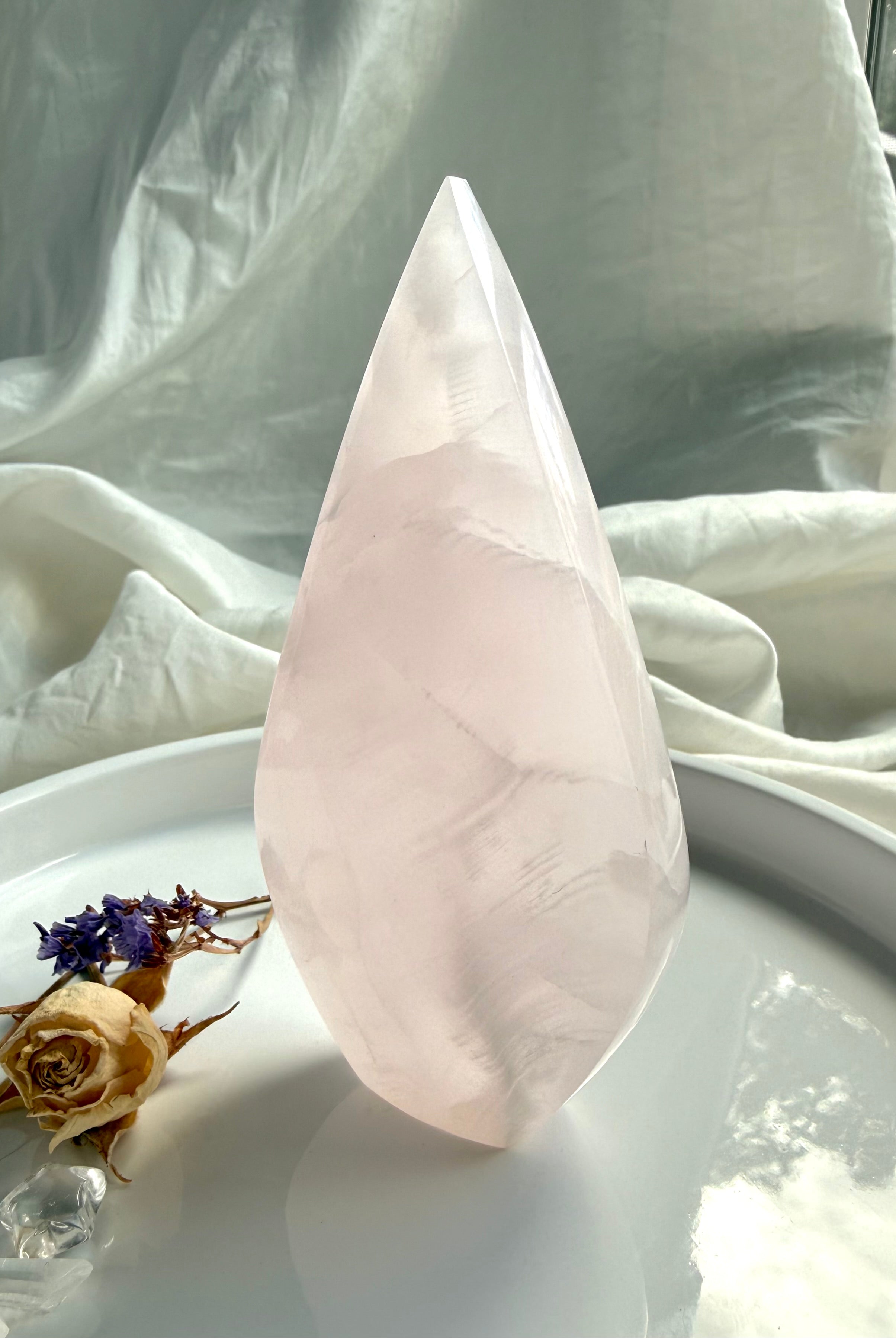 One of a kind pink Mangano Calcite flame displaying natural mineral patterns and calming heart-centered energy