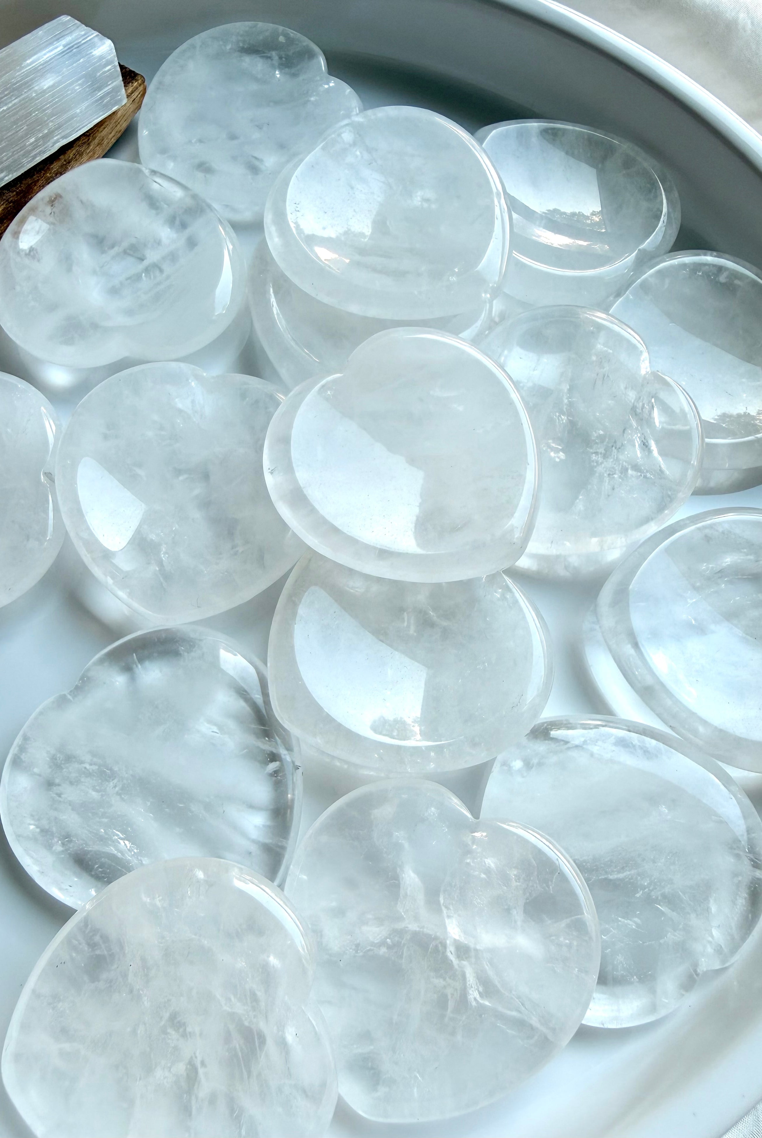 clear quartz heart stones grouped together for clarity focus and energy amplification