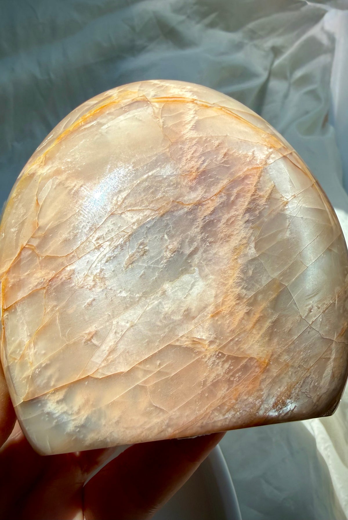 Sunstone shimmer side of Peach Moonstone freeform with sparkling golden aventurescence and warm peach feldspar tones