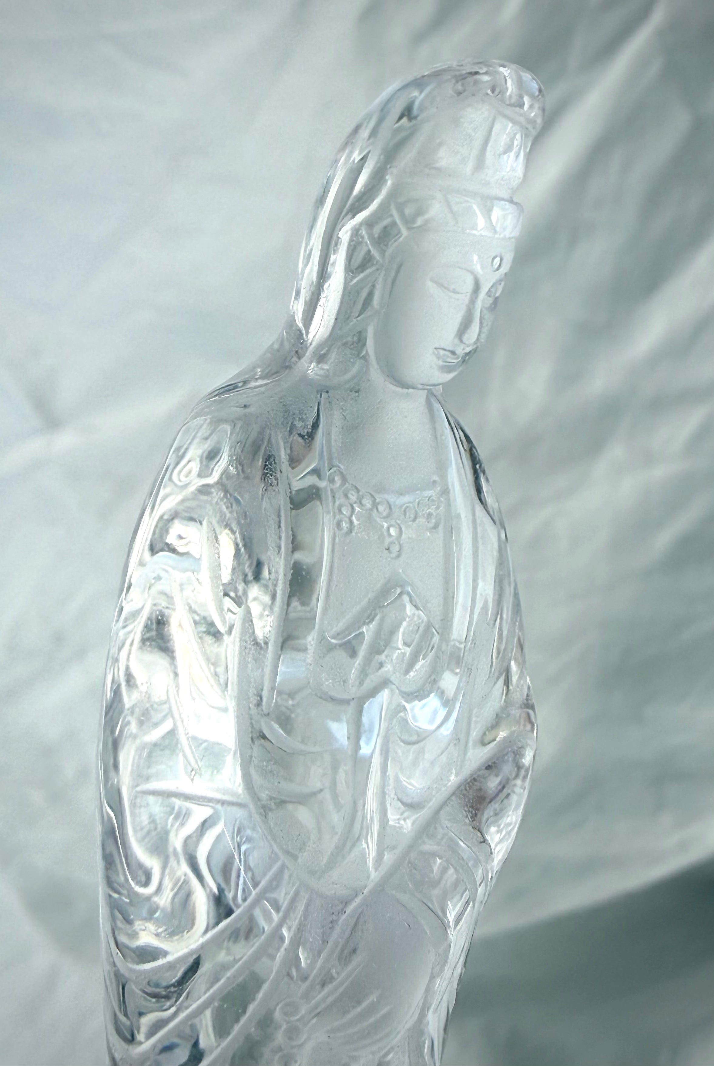 Transparent crystal Quan Yin statue symbolizing compassion, peace, and divine feminine wisdom