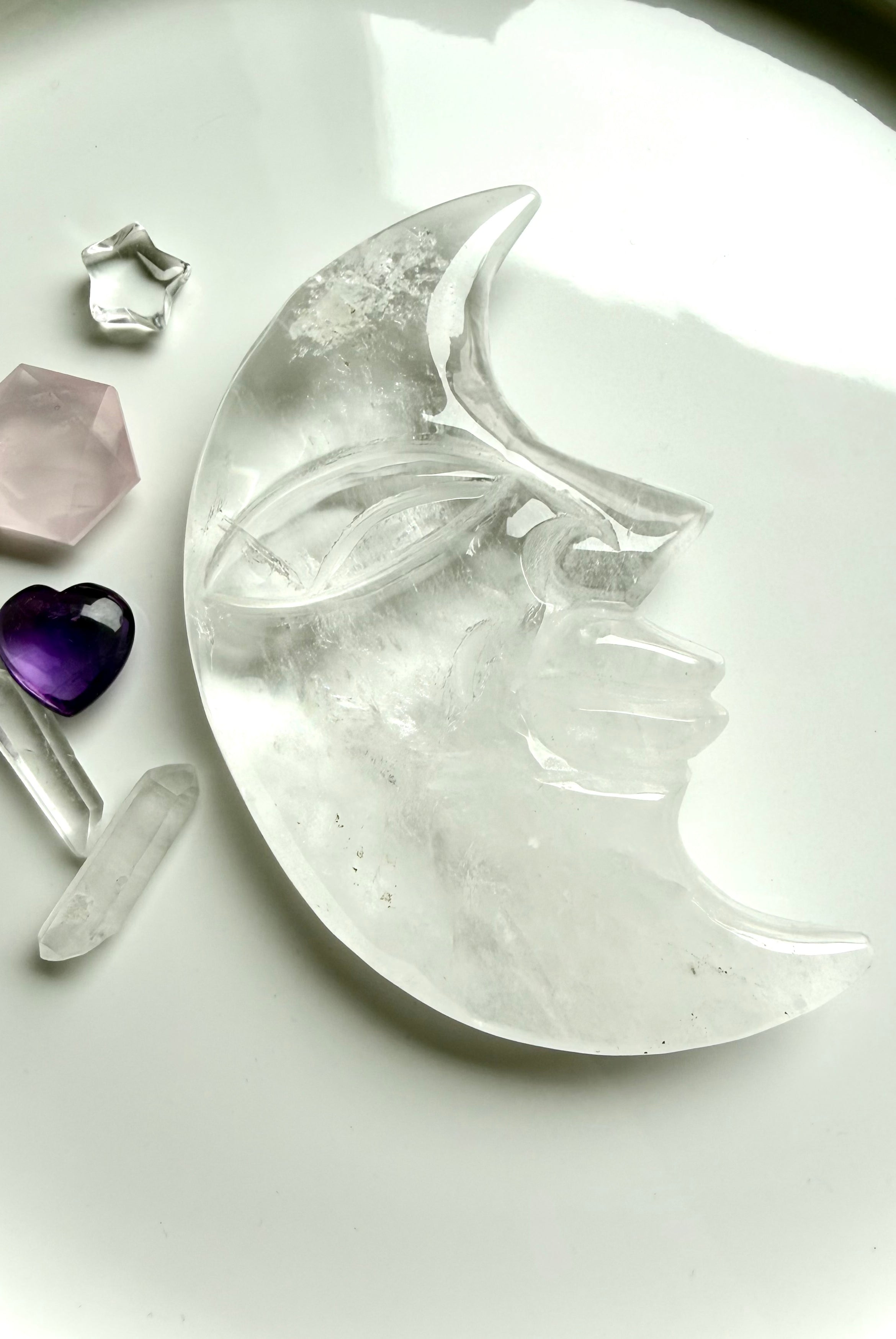 One-of-a-kind Clear Quartz Moon Face carving styled with crystals for moon rituals, meditation, and sacred space décor