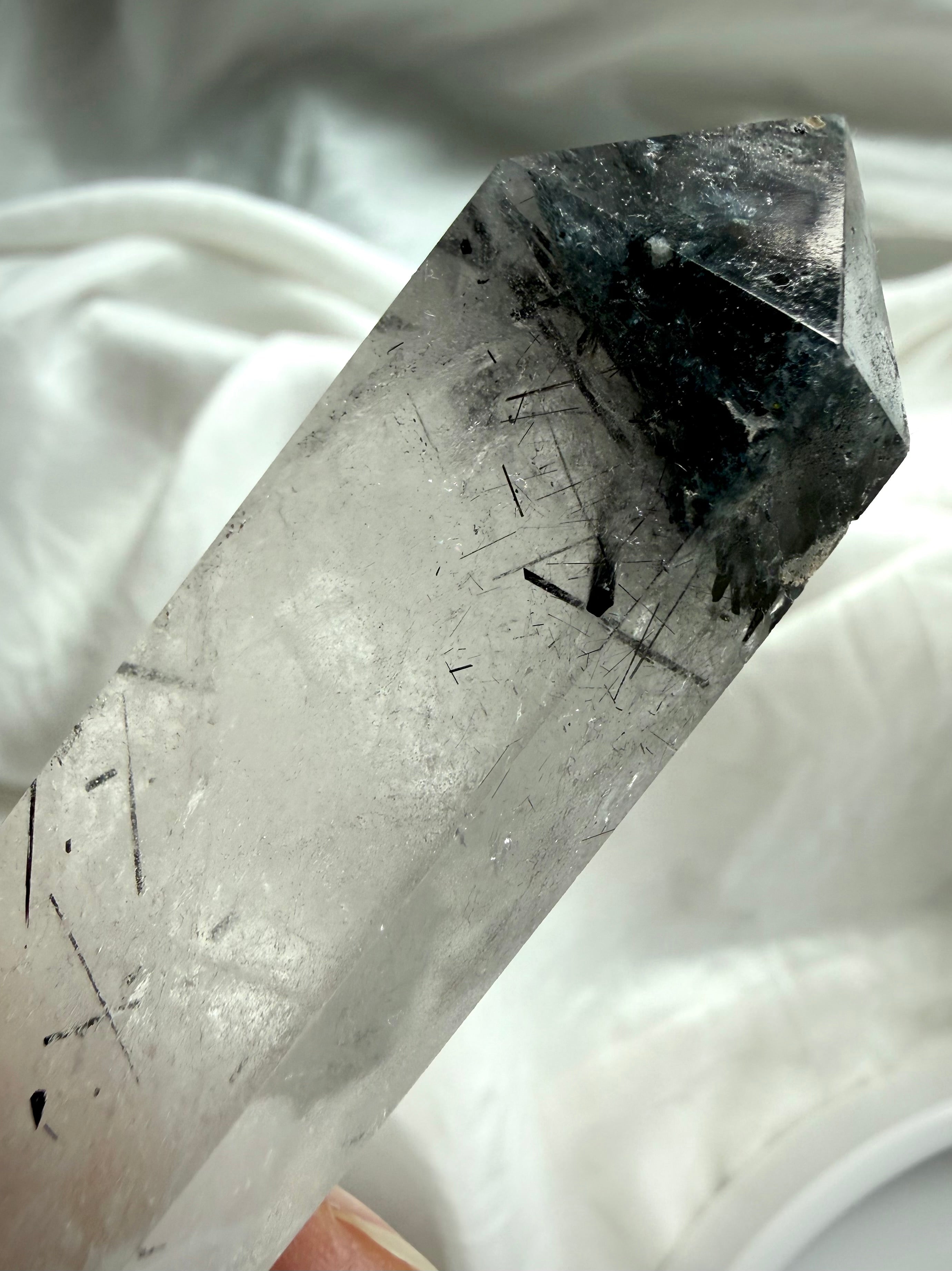 black tourmaline quartz crystal point close up showing black rutile inclusions and clarity