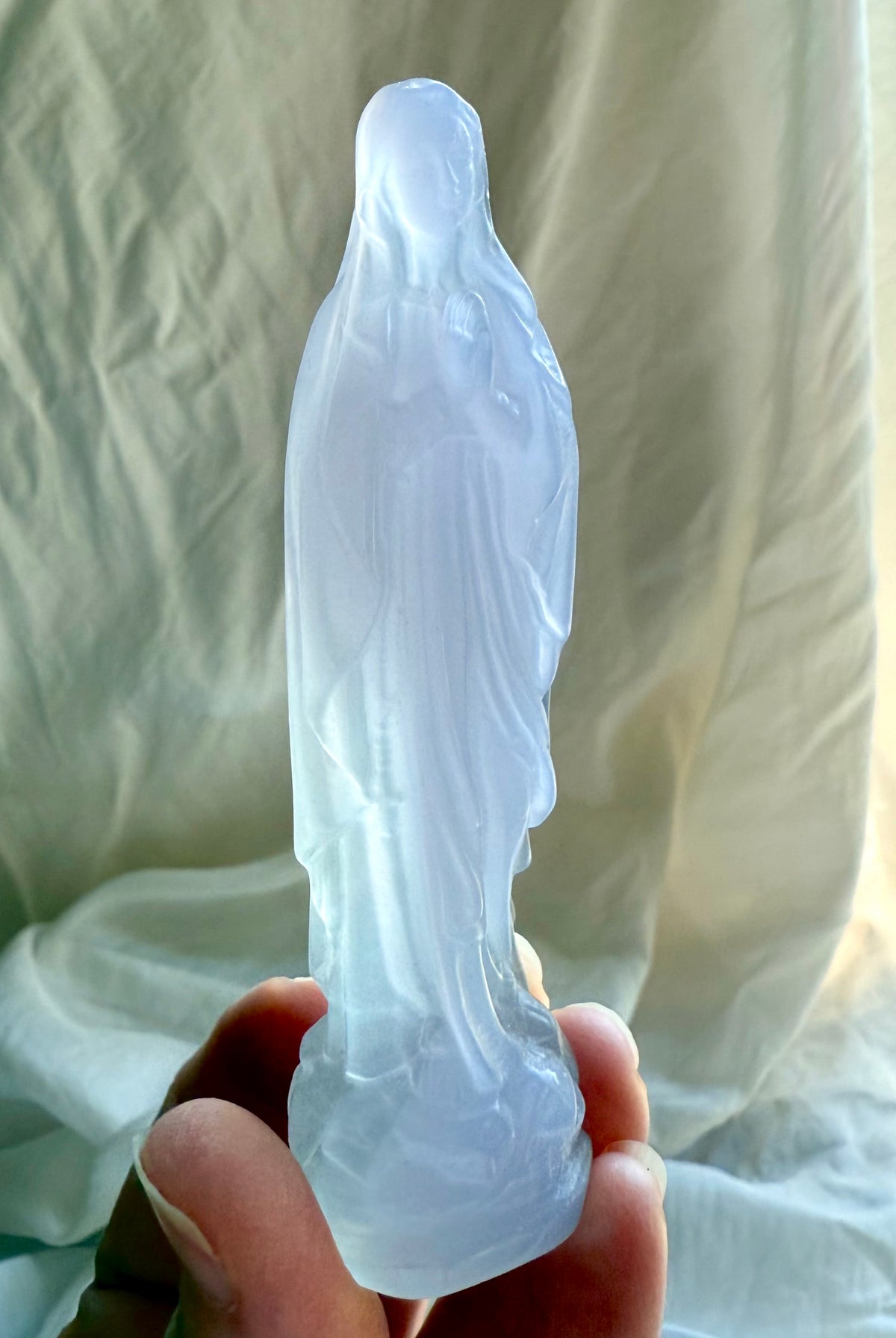 Yttrium Fluorite Mother Mary figurine with softly carved robes and pale lavender crystal coloring