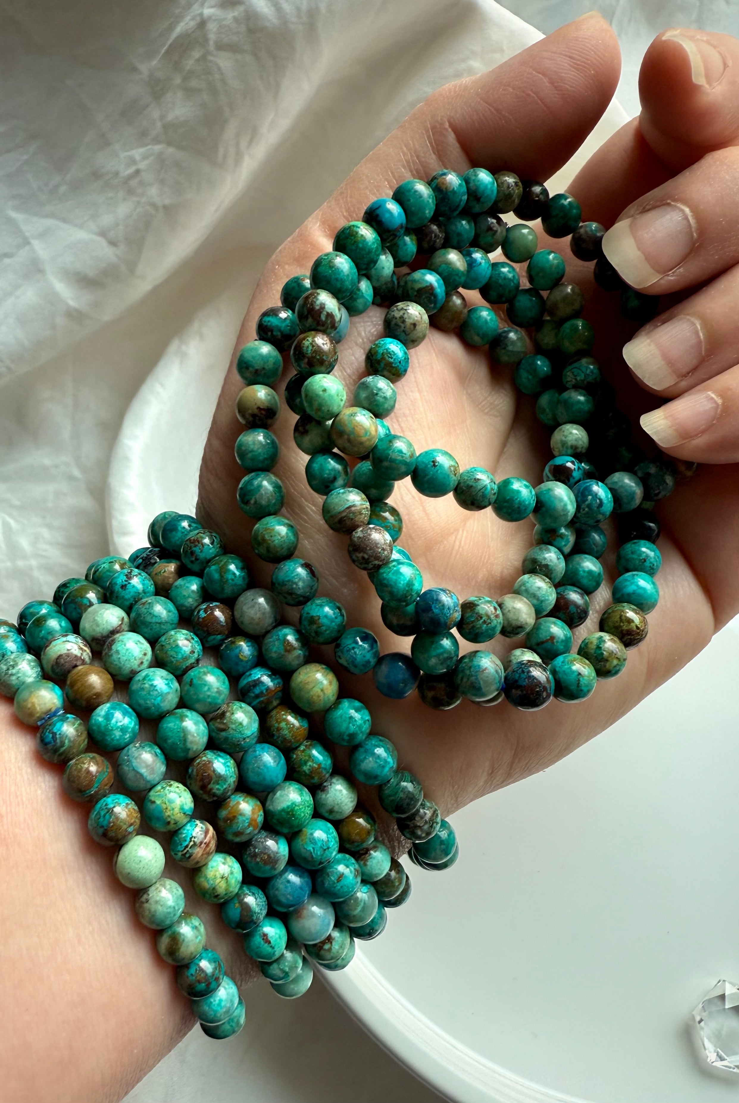 Chrysocolla Shattuckite beaded bracelets wrapped around wrist, turquoise-toned crystal jewelry for spiritual communication