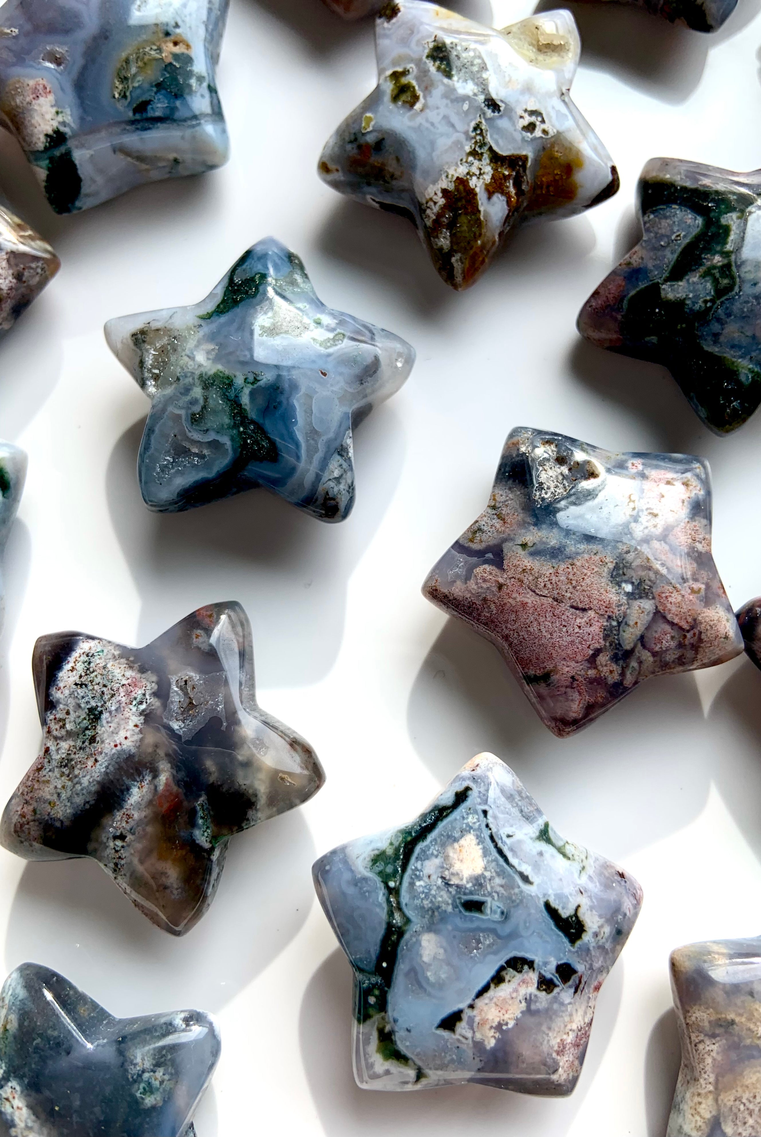 Closeup of Cosmic Ocean Jasper star carvings showing orbicular patterns, rare healing crystals for balance, grounding, and spiritual growth