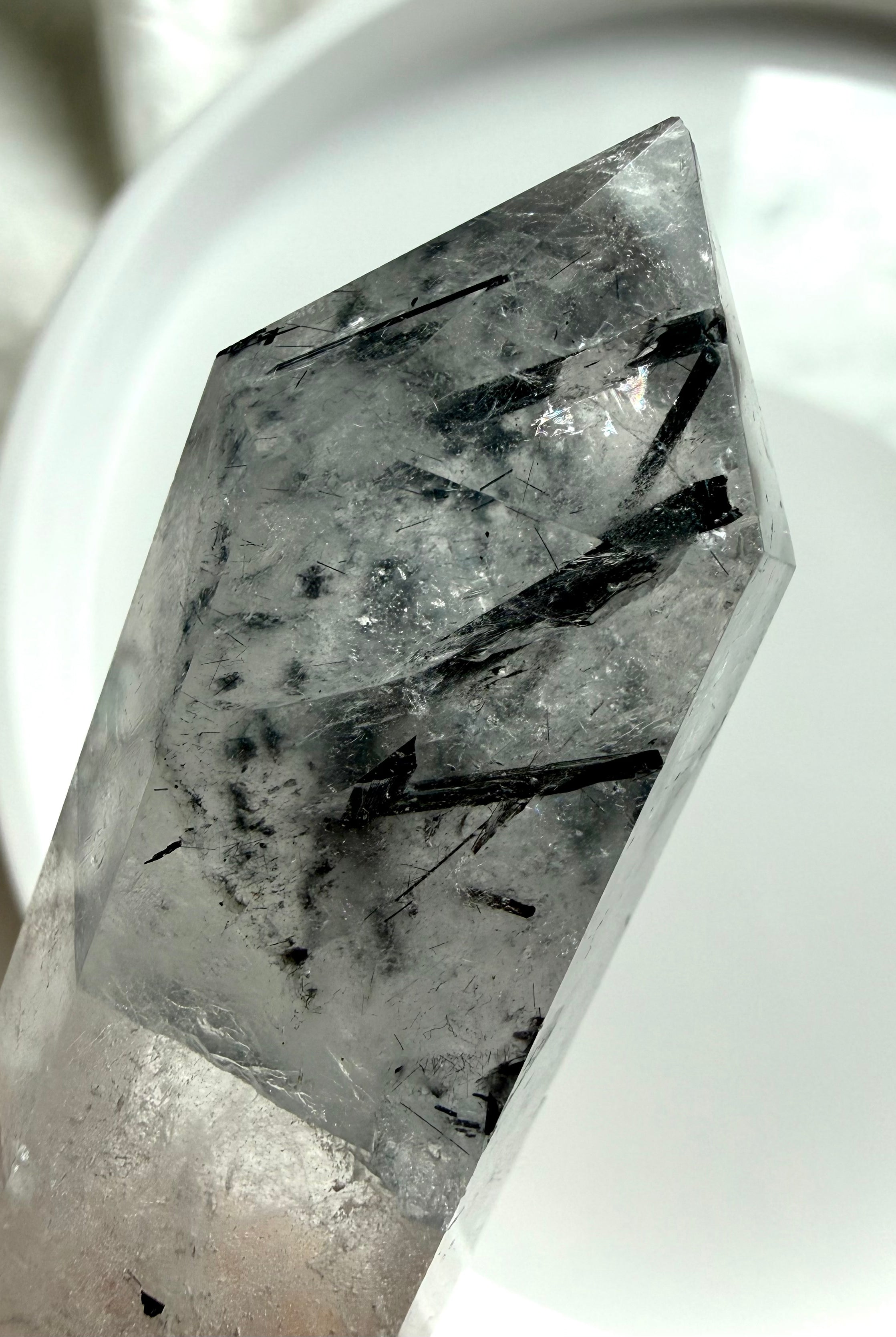 black tourmaline in quartz point tip showing needle inclusions