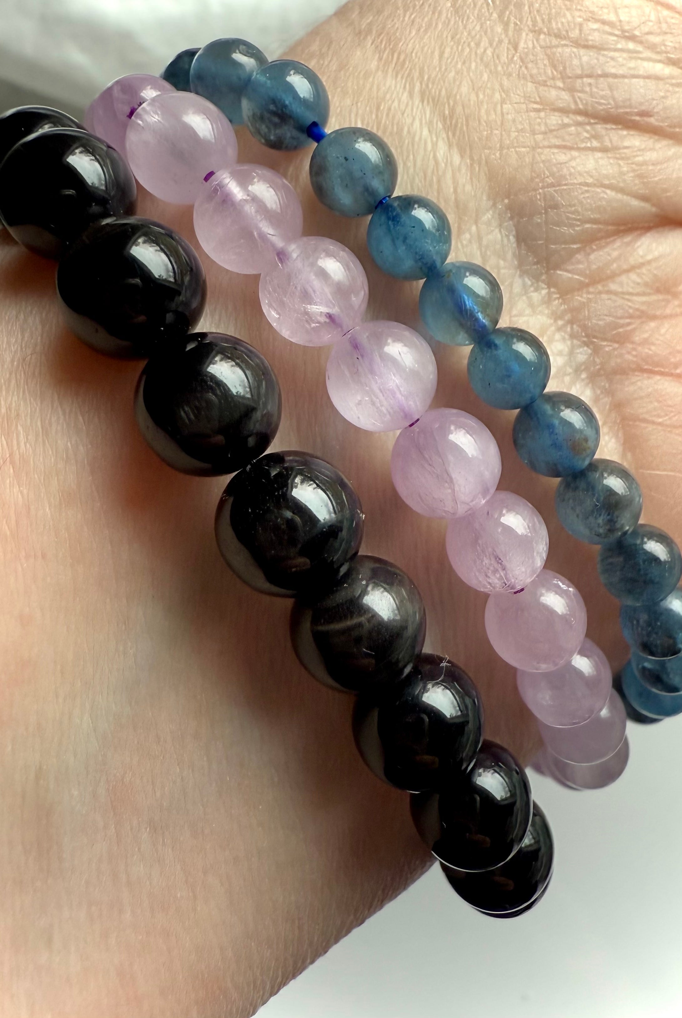 Our Black Tigers Eye Bracelet worn with Devil Aquamarine + Watermelon Lilac Kunzite Bracelets