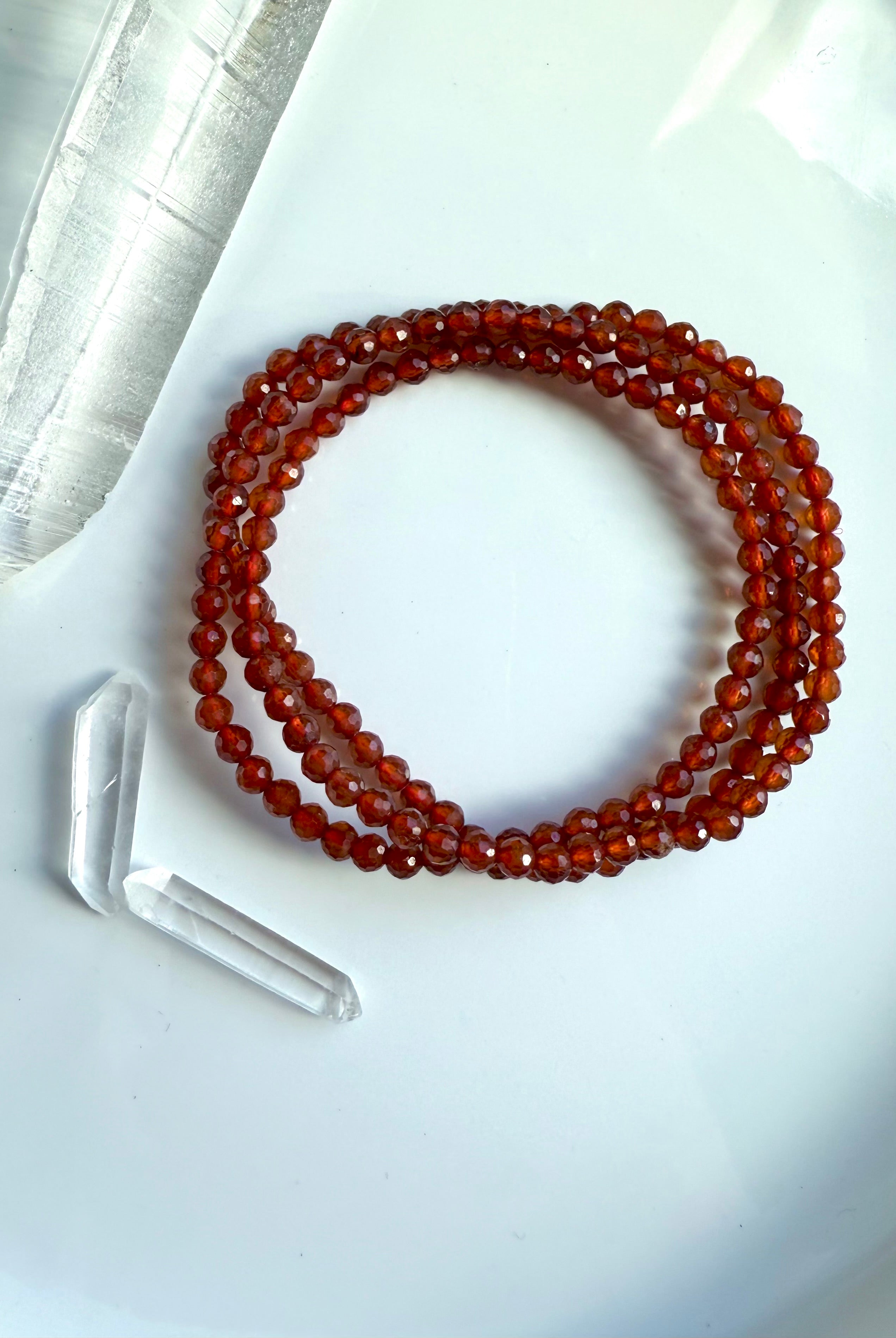A sparkly faceted Spessartite Garnet Wrap Bracelet with lovely depth of color + gemmy transparency