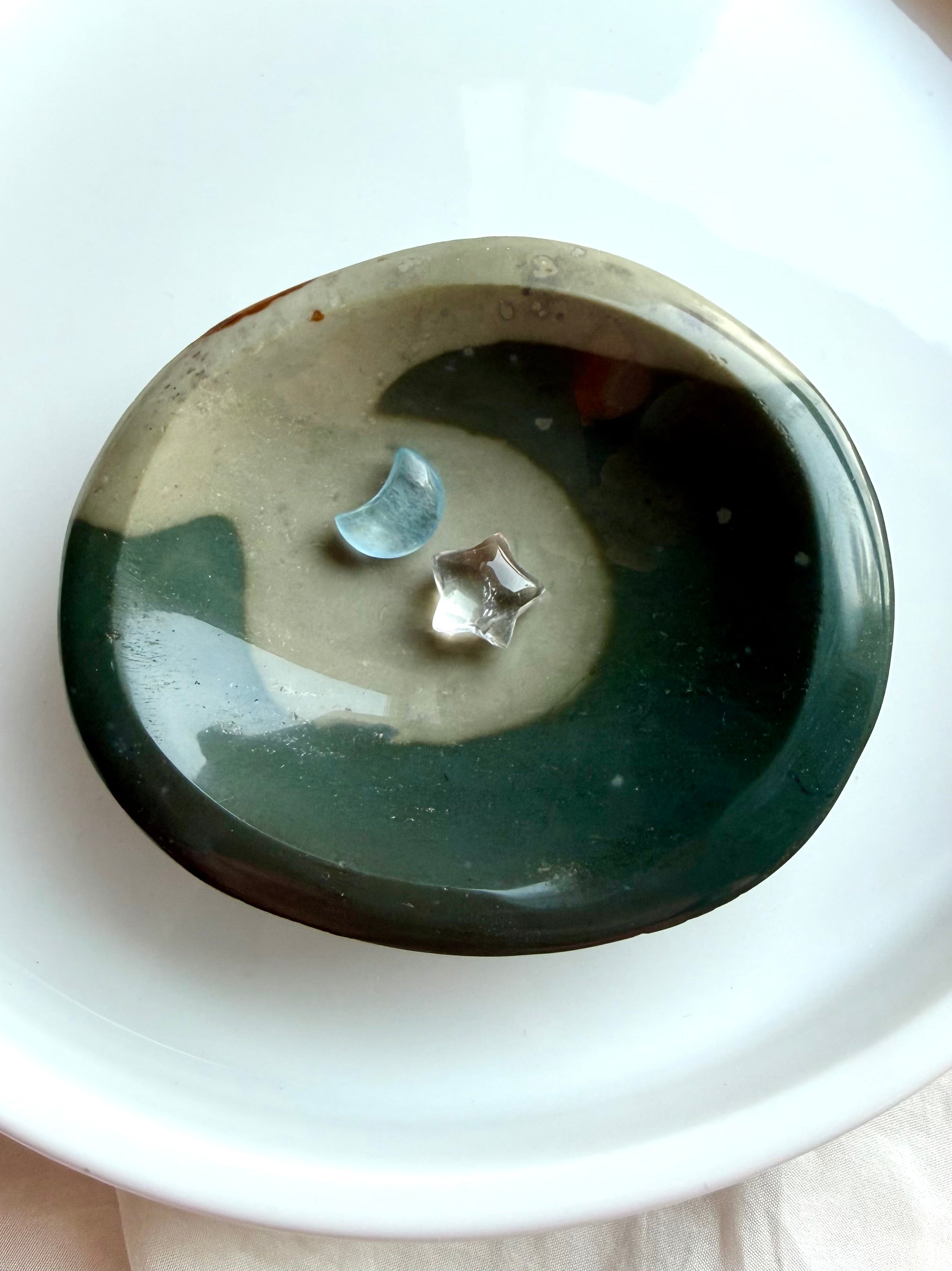 shallow polychrome jasper crystal bowl with flowing teal wave pattern and earthy tones