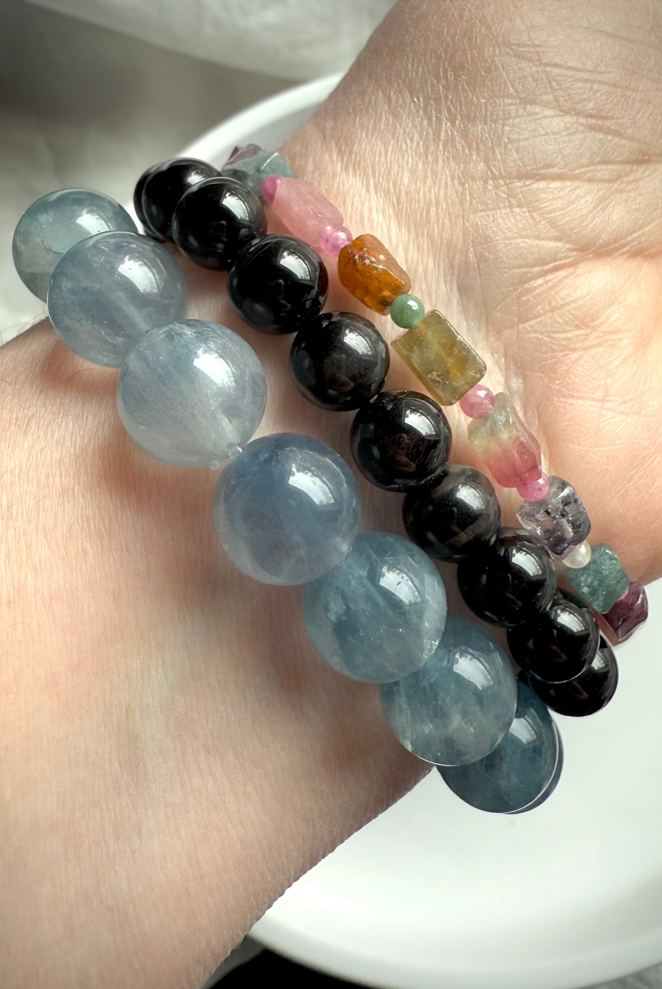 Our Black Tigers Eye Bracelet worn with Ice Blue Fluorite + Watermelon Tourmaline Bracelets
