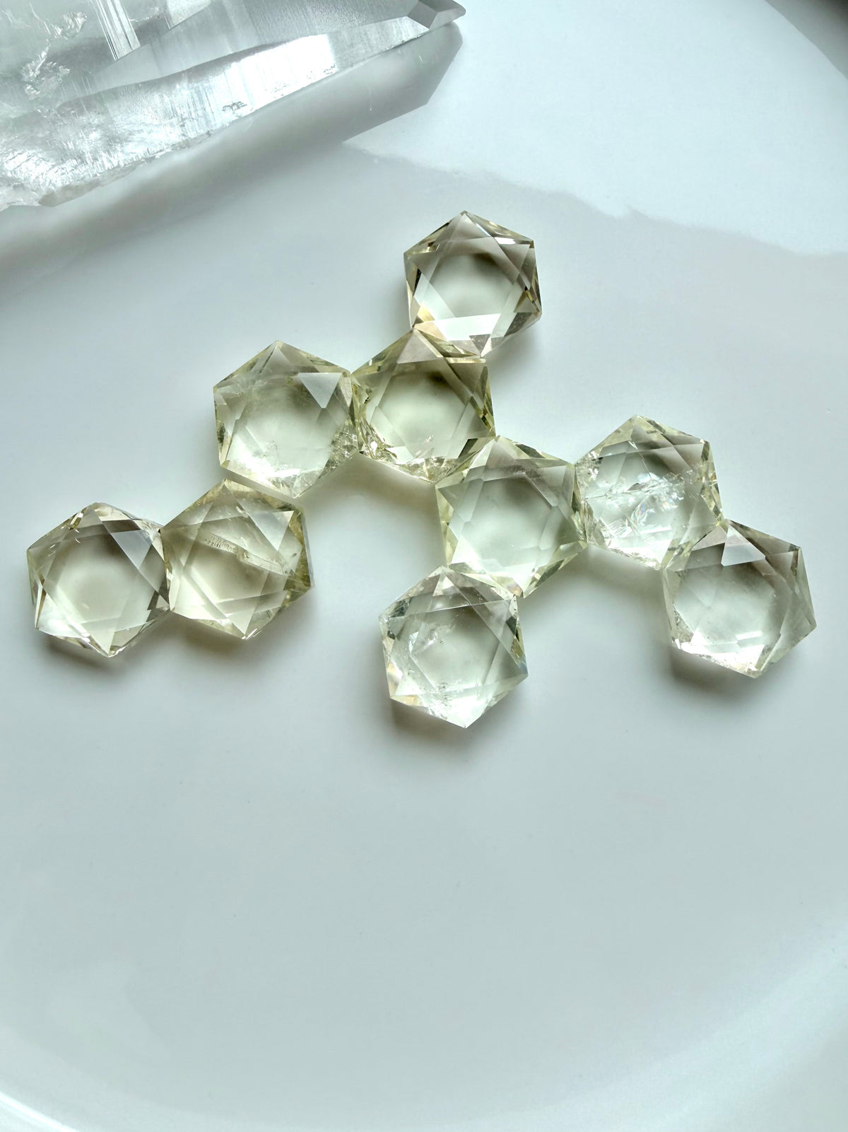 Citrine hexagons arranged in a sacred geometry crystal grid for abundance, manifestation, and intention setting