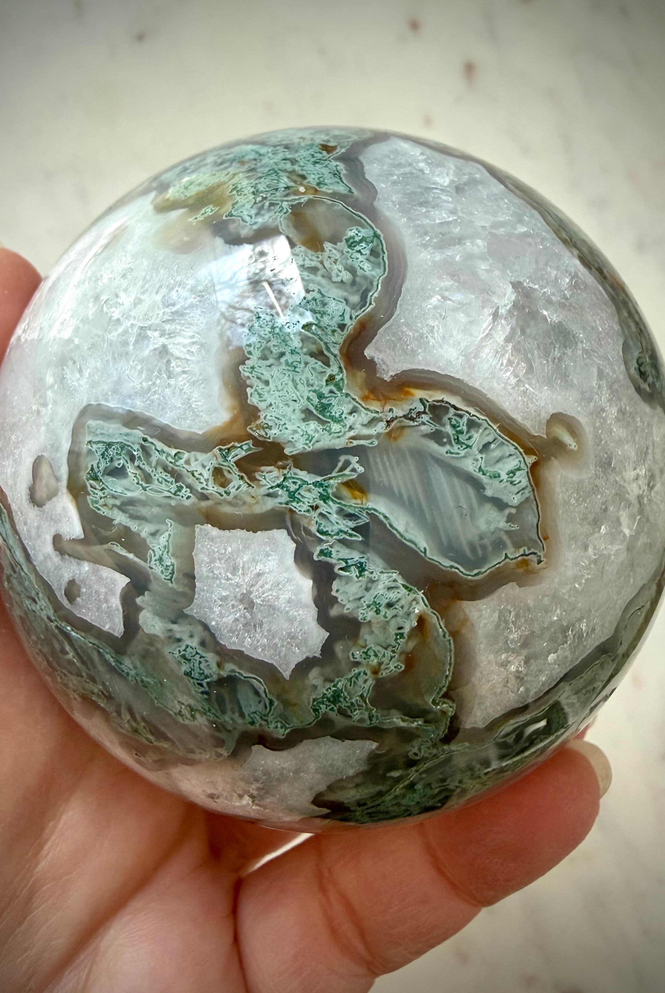 Large Moss Agate crystal ball with white Quartz formations and scenic forest-like mineral inclusions