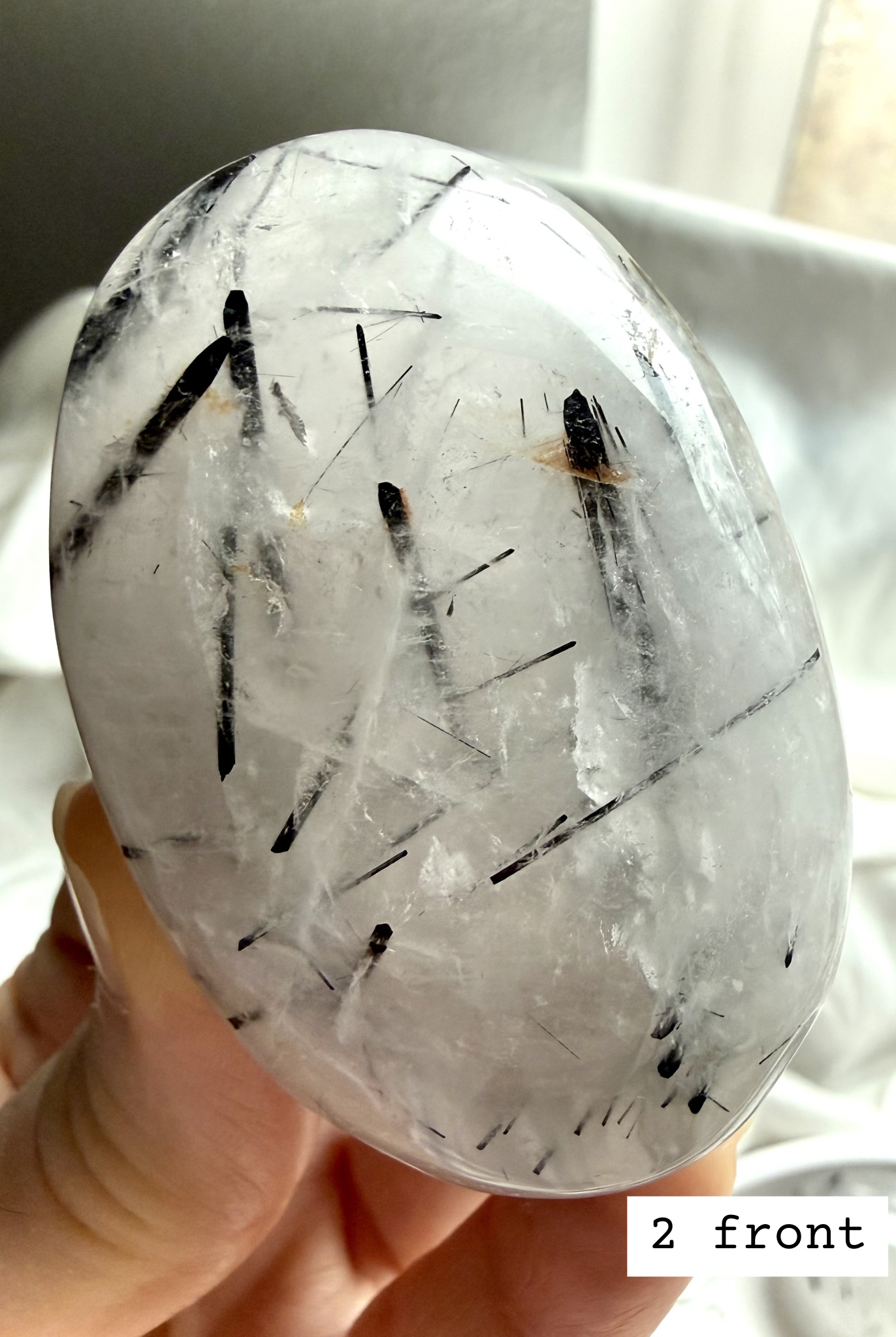 Black Tourmaline in Quartz palm stone 2 front view Tourmalinated Quartz grounding crystal