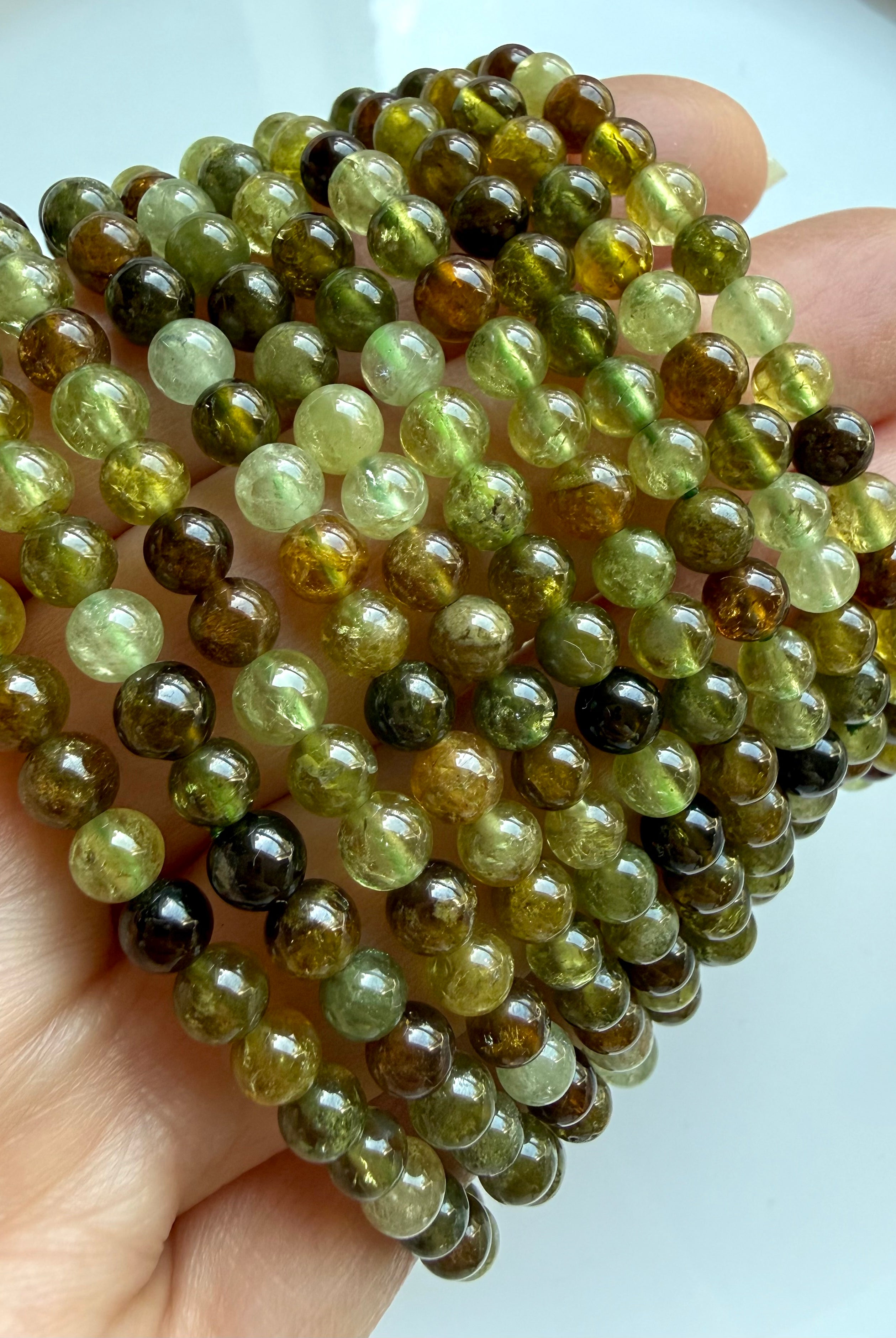 Transparent Tsavorite Garnet bracelets with luminous green crystal gemstones and earthy luxury aesthetic
