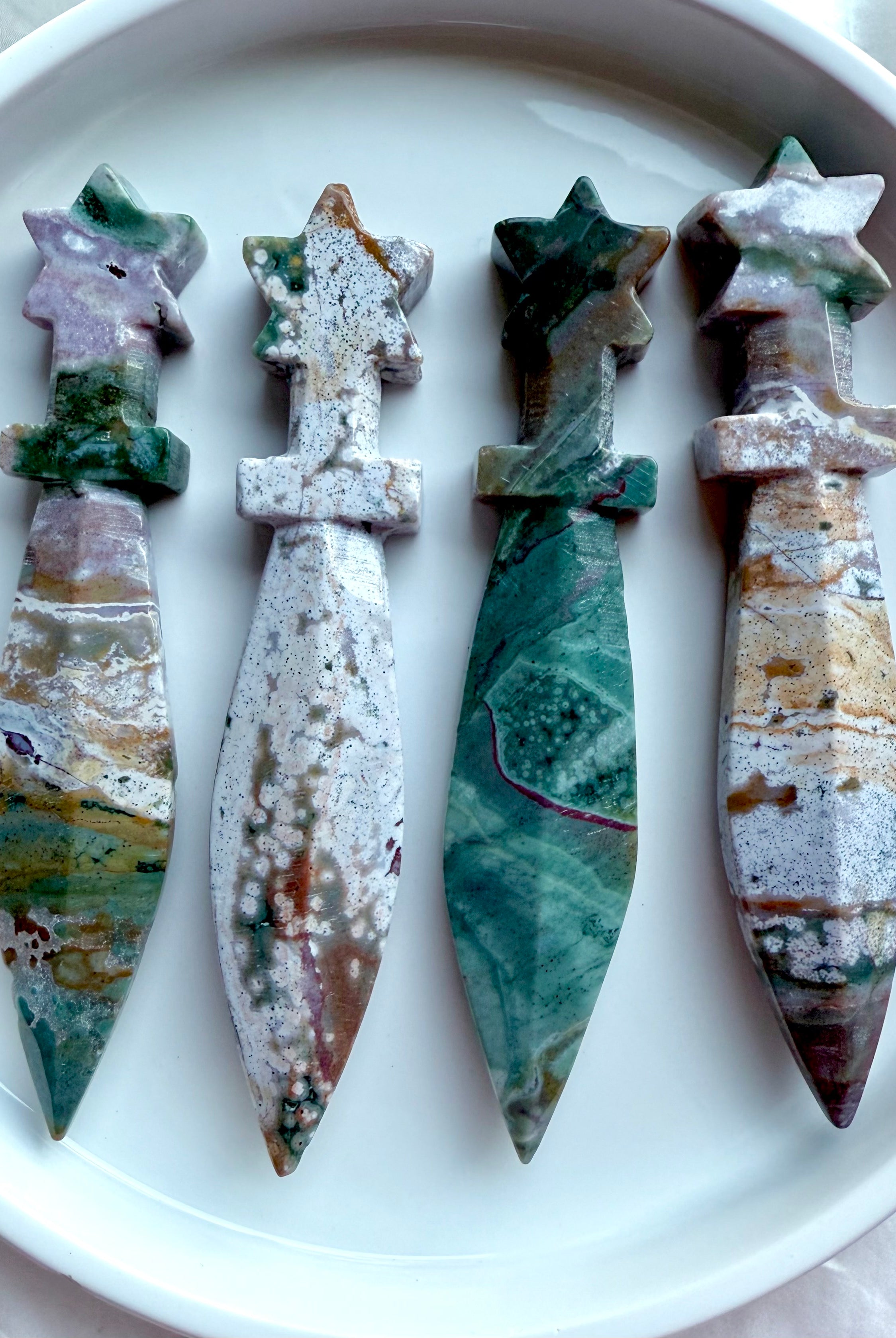 Ocean Jasper star knives – crystal athames with celestial star handles and polished stone blades, shown together in group display