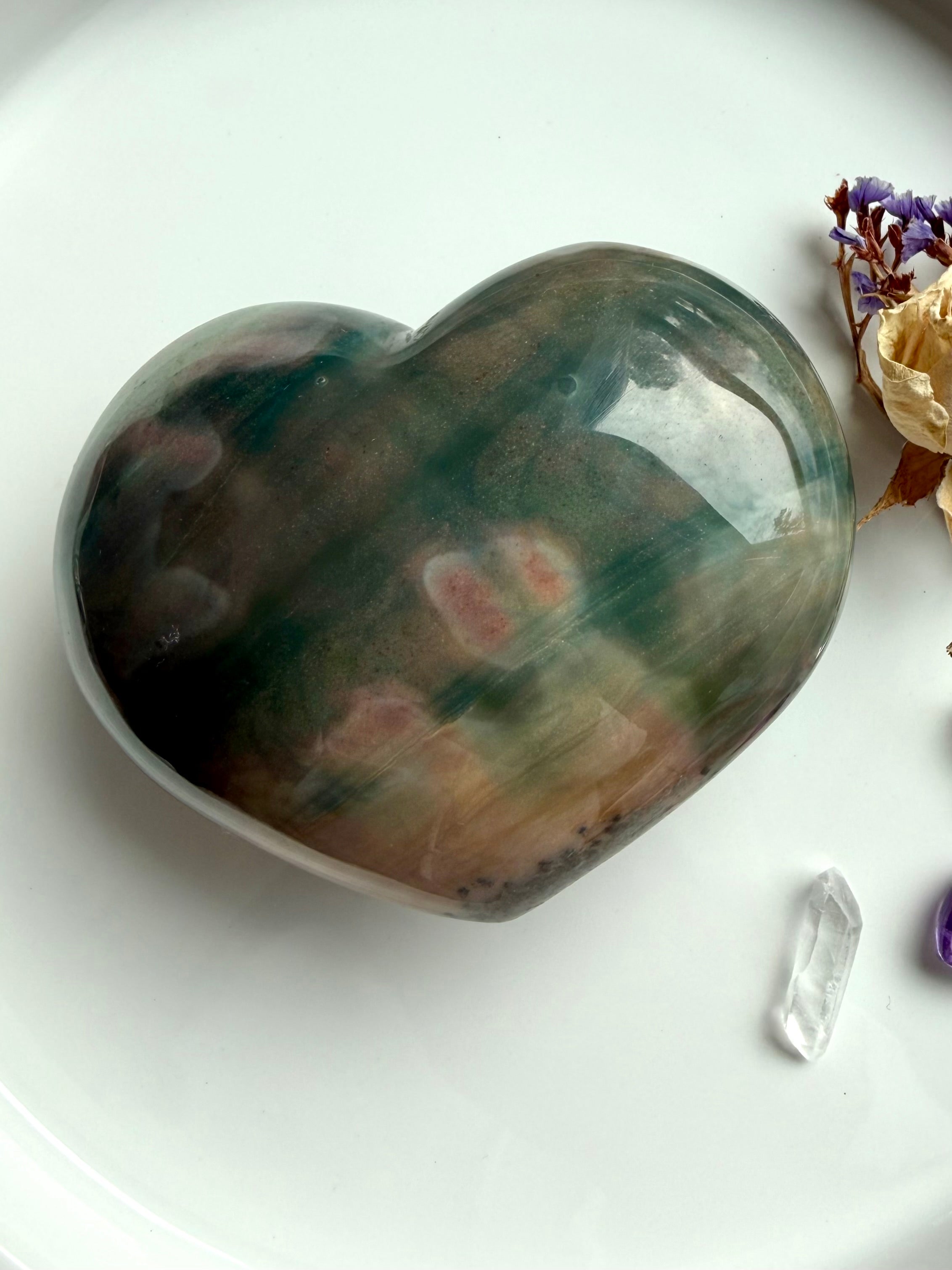 overhead view of Premium Ocean Jasper heart carving with layered ocean-inspired patterns from Madagascar