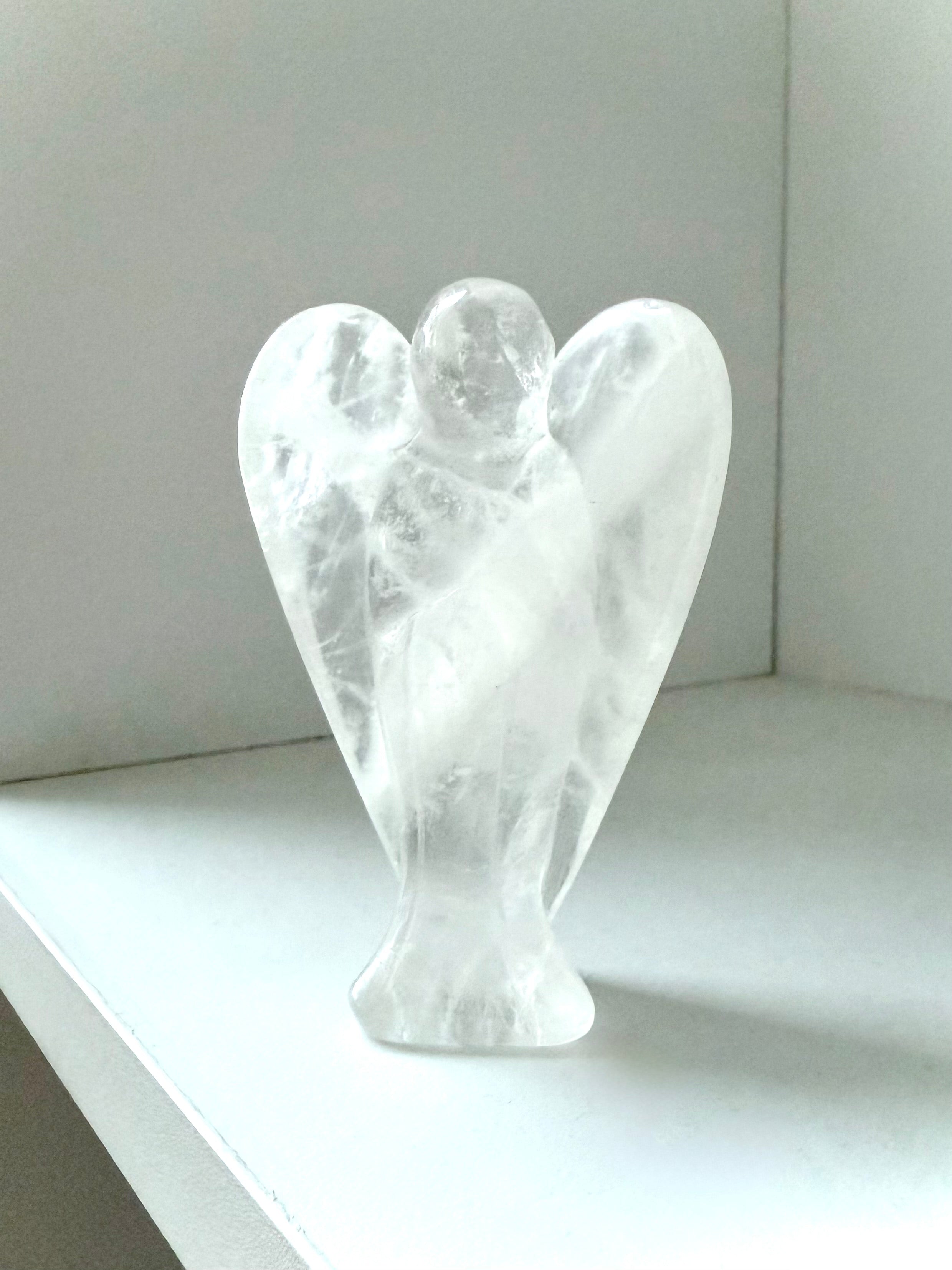 This Clear Quartz Crystal Angel Figurine easily fits in with any style of decor or color scheme