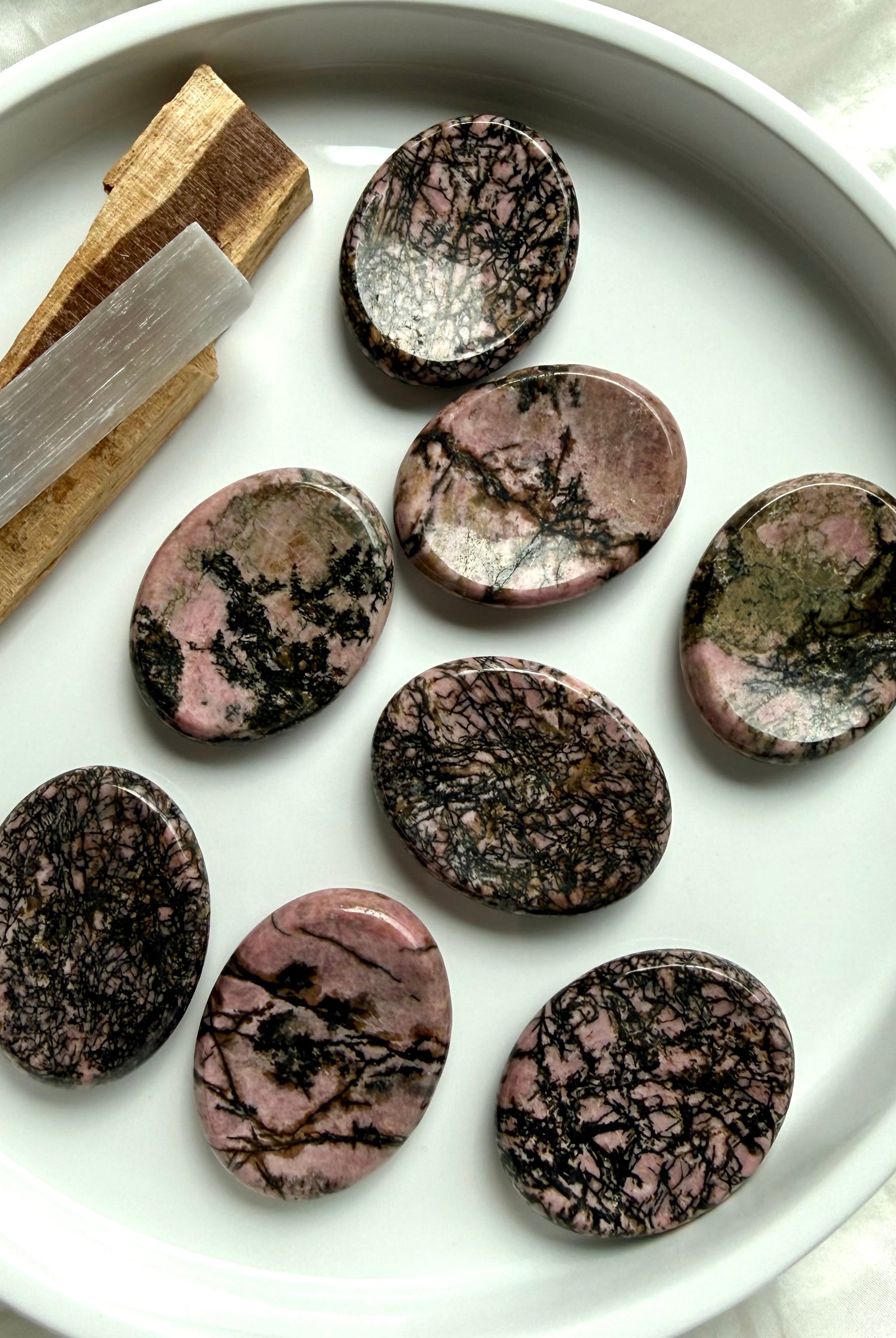 Polished Rhodonite thumb stones with natural pink and black patterns