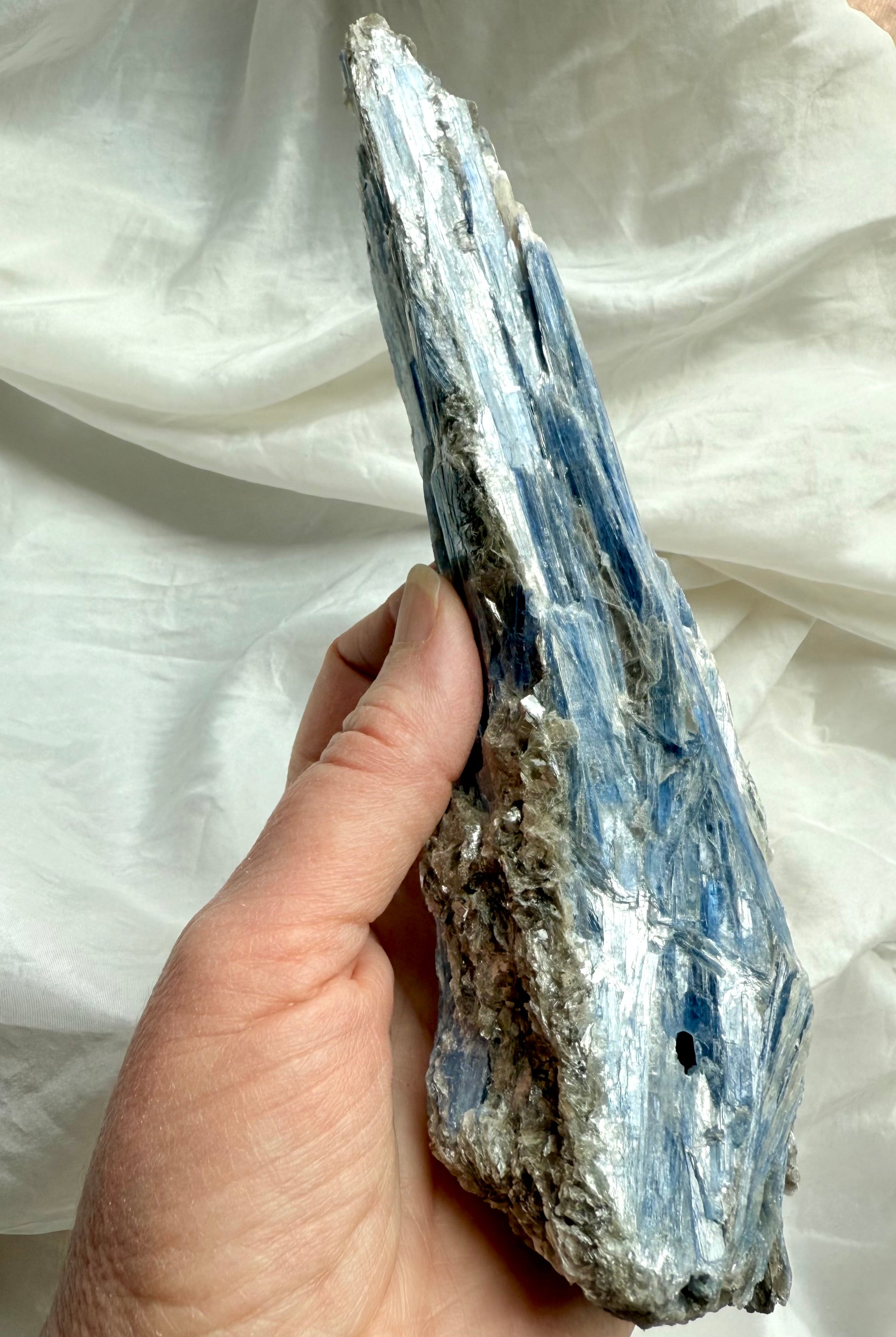 raw blue kyanite crystal blades with muscovite shimmer, natural healing stone