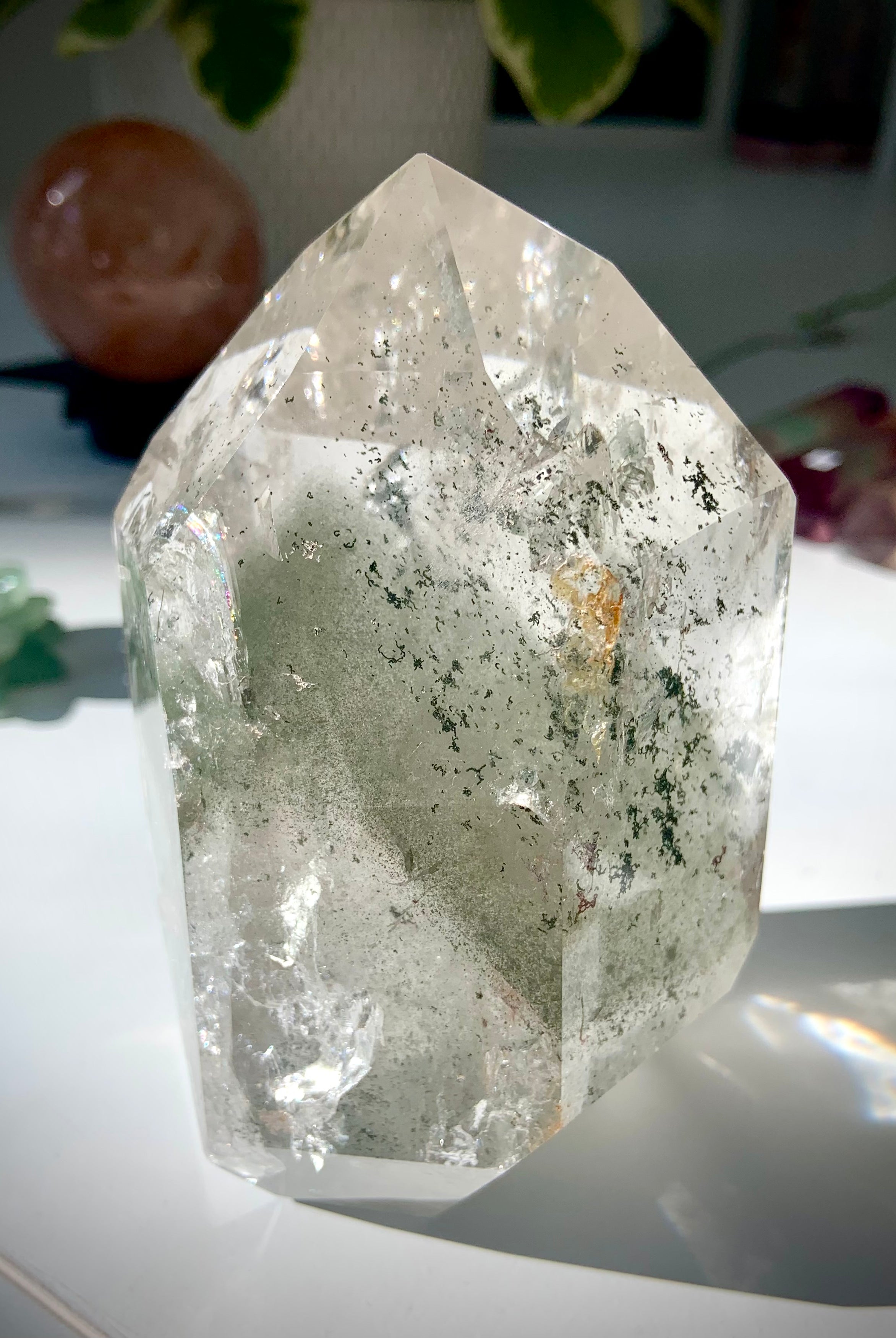 A self standing Garden Quartz Lodolite Crystal with phantoms, mossy mineral inclusions + rainbows