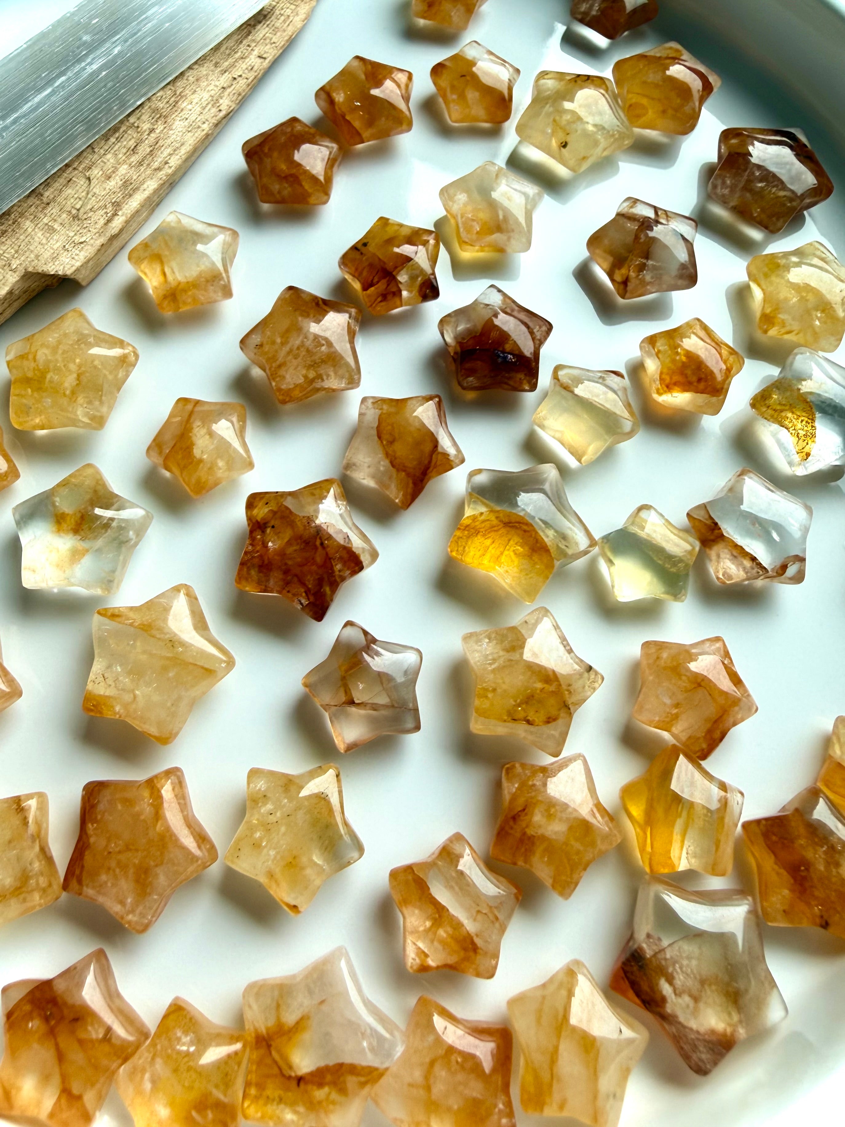 Golden Healer Quartz mini star carvings with golden Hematoid inclusions for healing energy, manifestation, and crystal grids