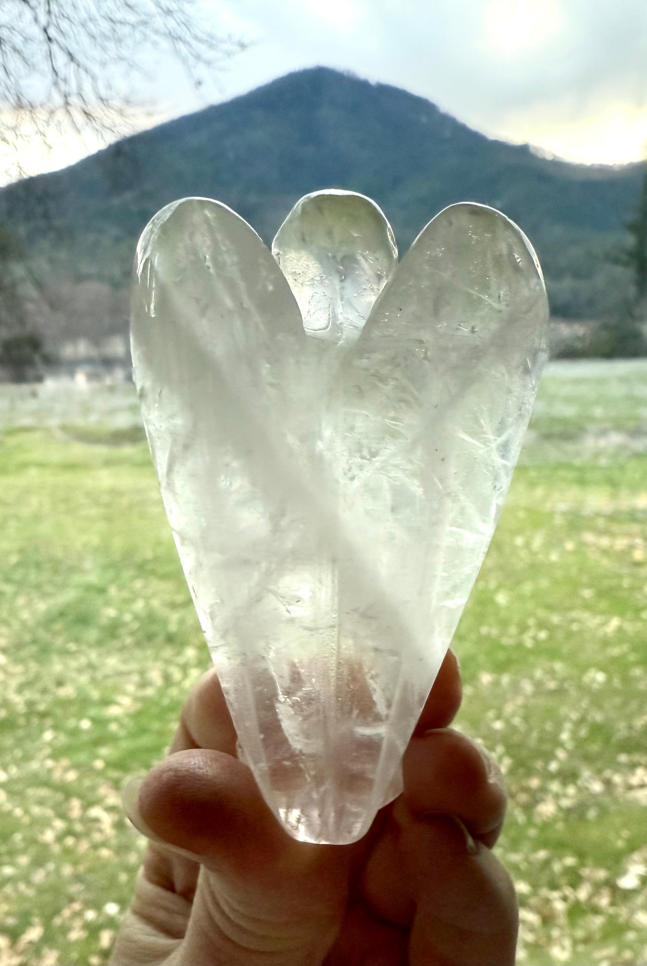 The crystal angel figurine has a beautiful natural zigzag pattern in the stone