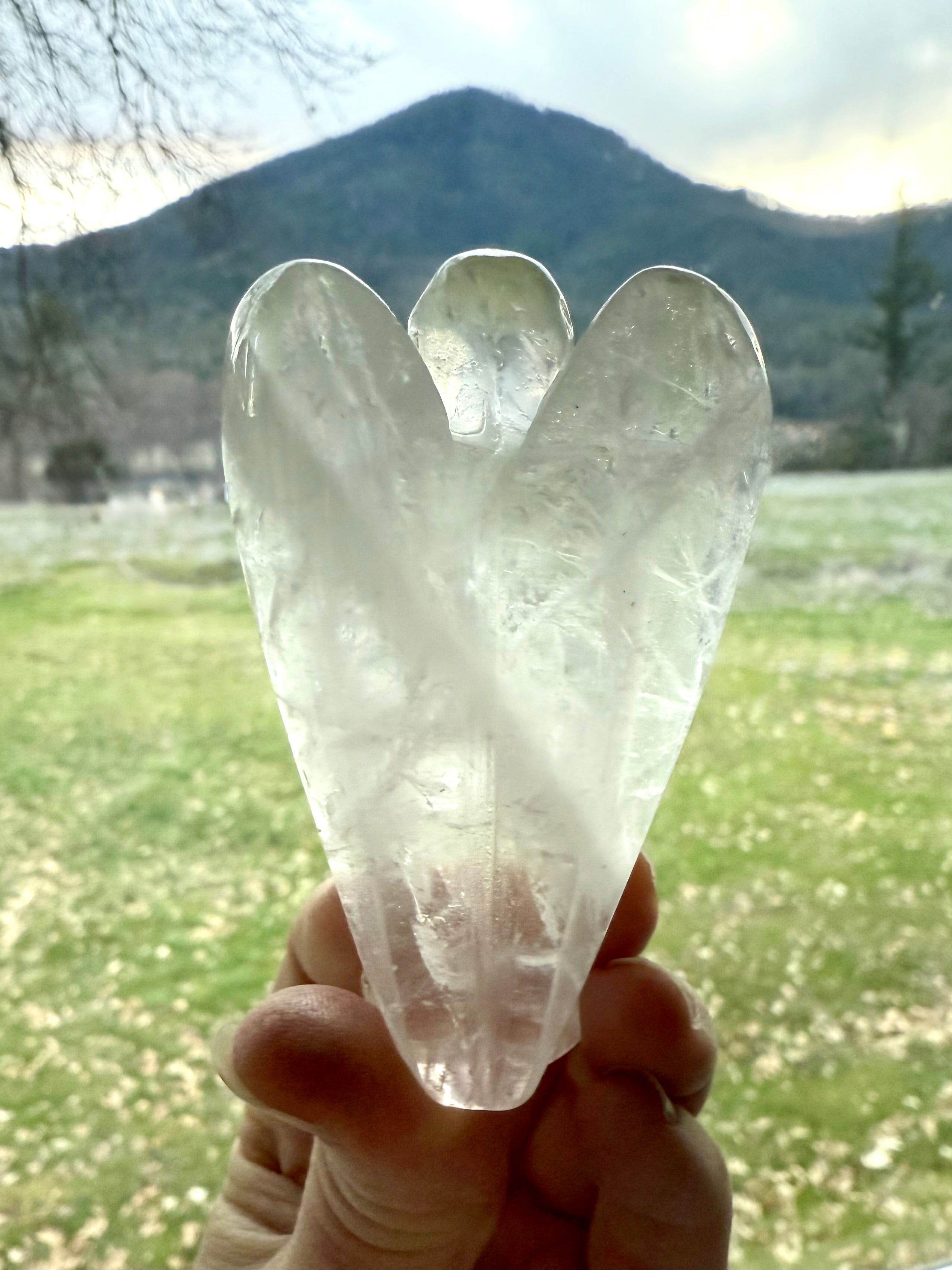 The crystal angel figurine has a beautiful natural zigzag pattern in the stone