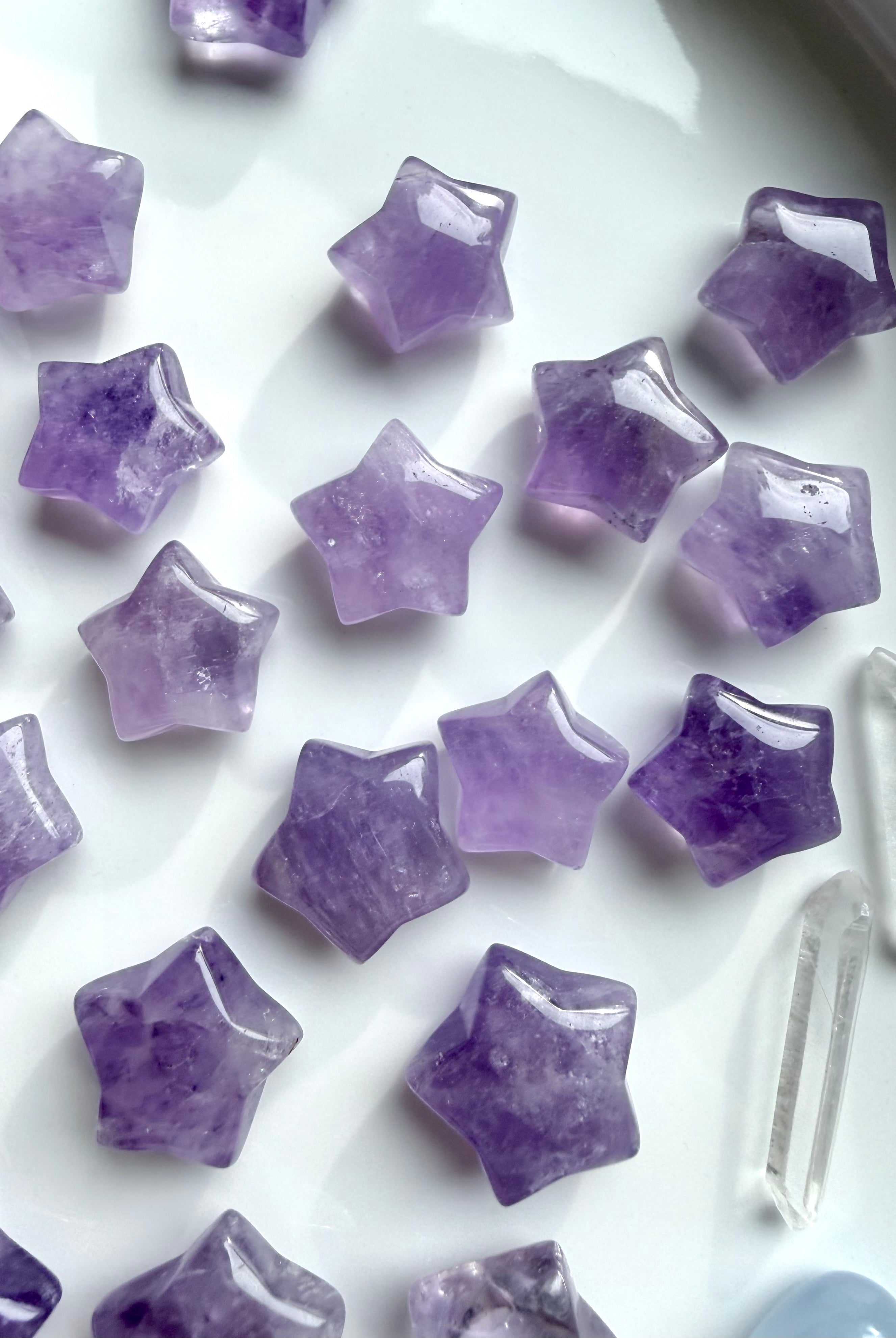 Mini Amethyst star carvings with soft lavender and purple tones, polished crystal stars for peace, clarity, and calming energy