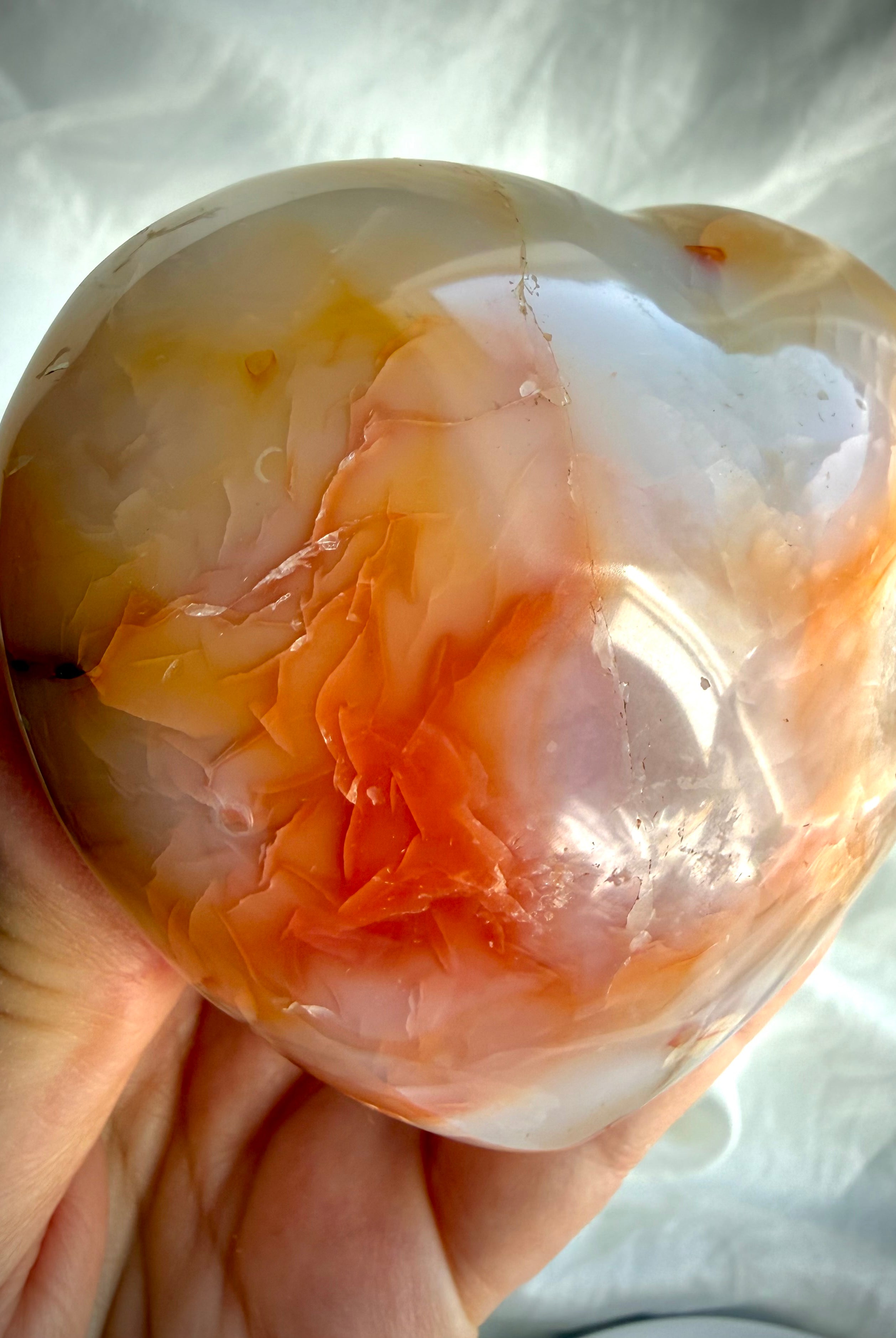 One-of-a-kind Carnelian heart with translucent orange banding and natural color variations in polished finish