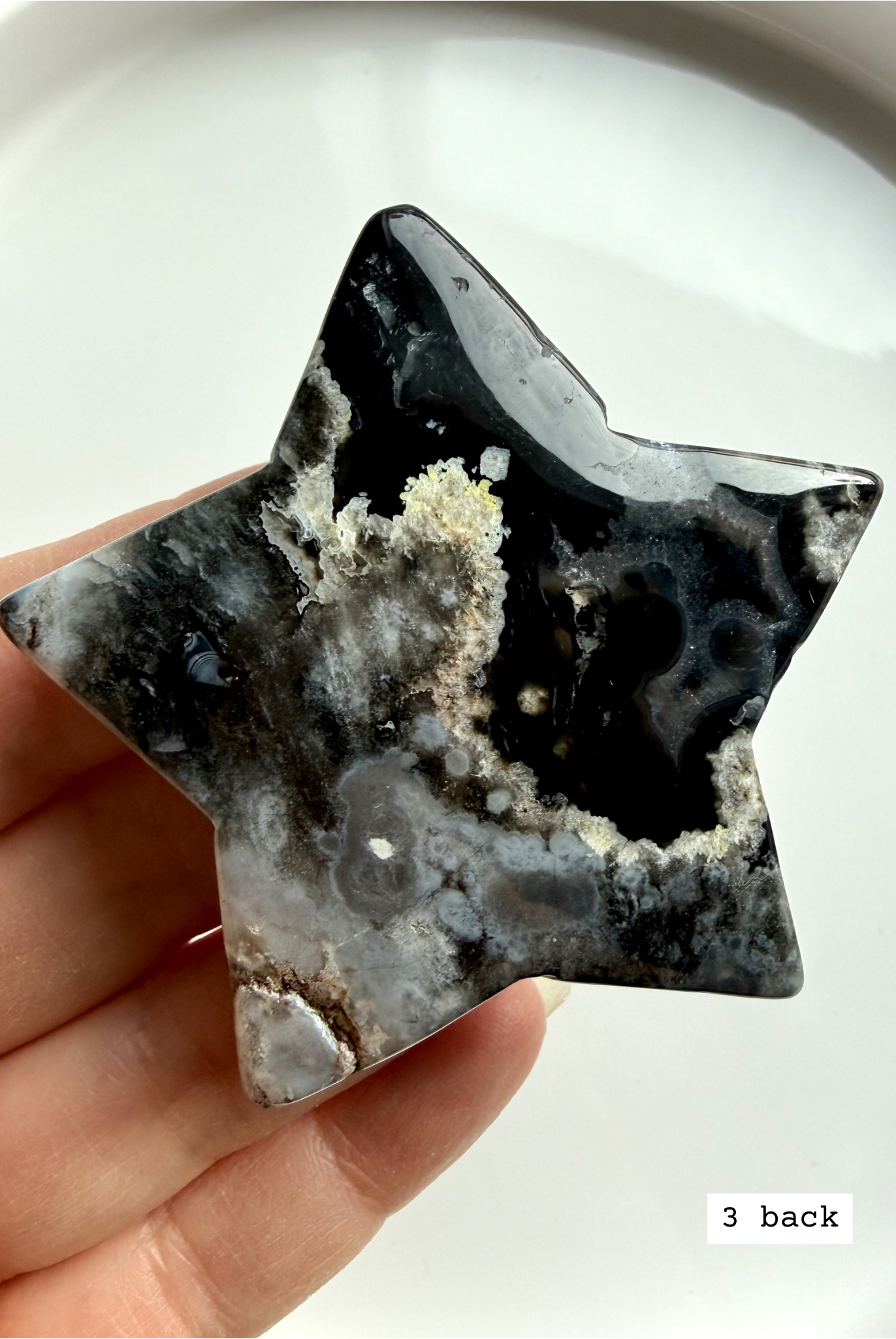black flower agate star carving #3 back showing organic mineral patterning and natural variation