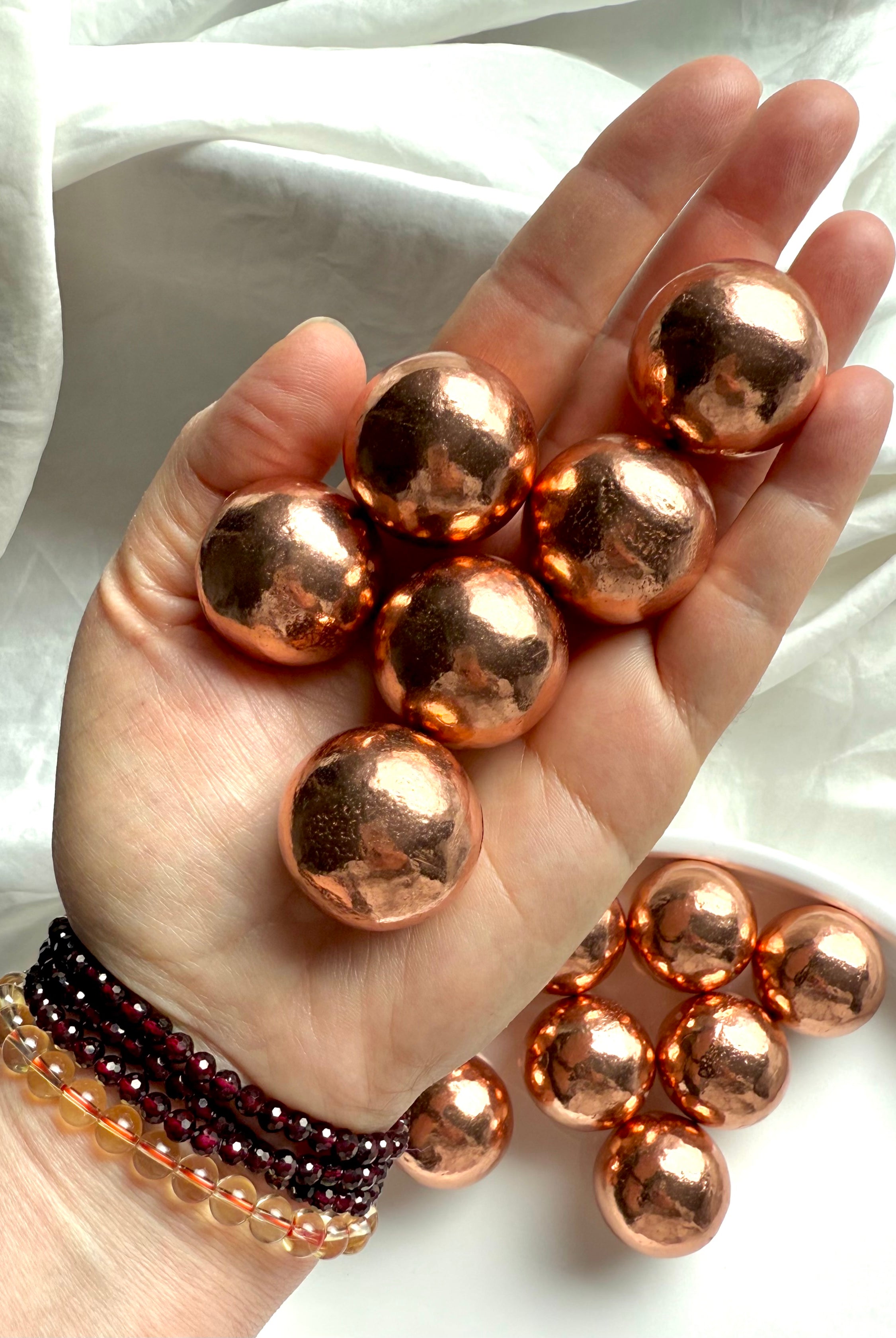 30 mm diameter Michigan copper spheres shown in my hand for scale