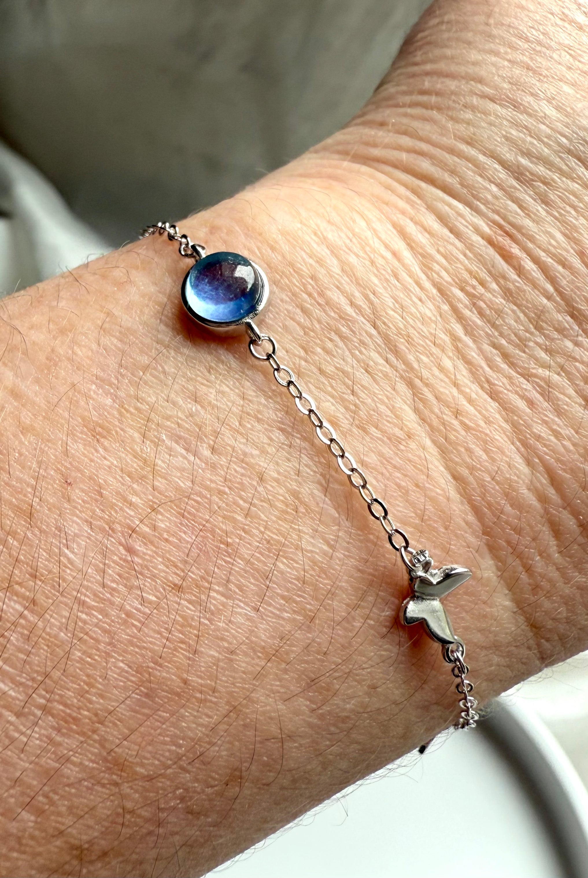 Sterling silver aquamarine butterfly bracelet with blue gemstone centerpiece, dainty jewelry for clarity, peace, and gift giving