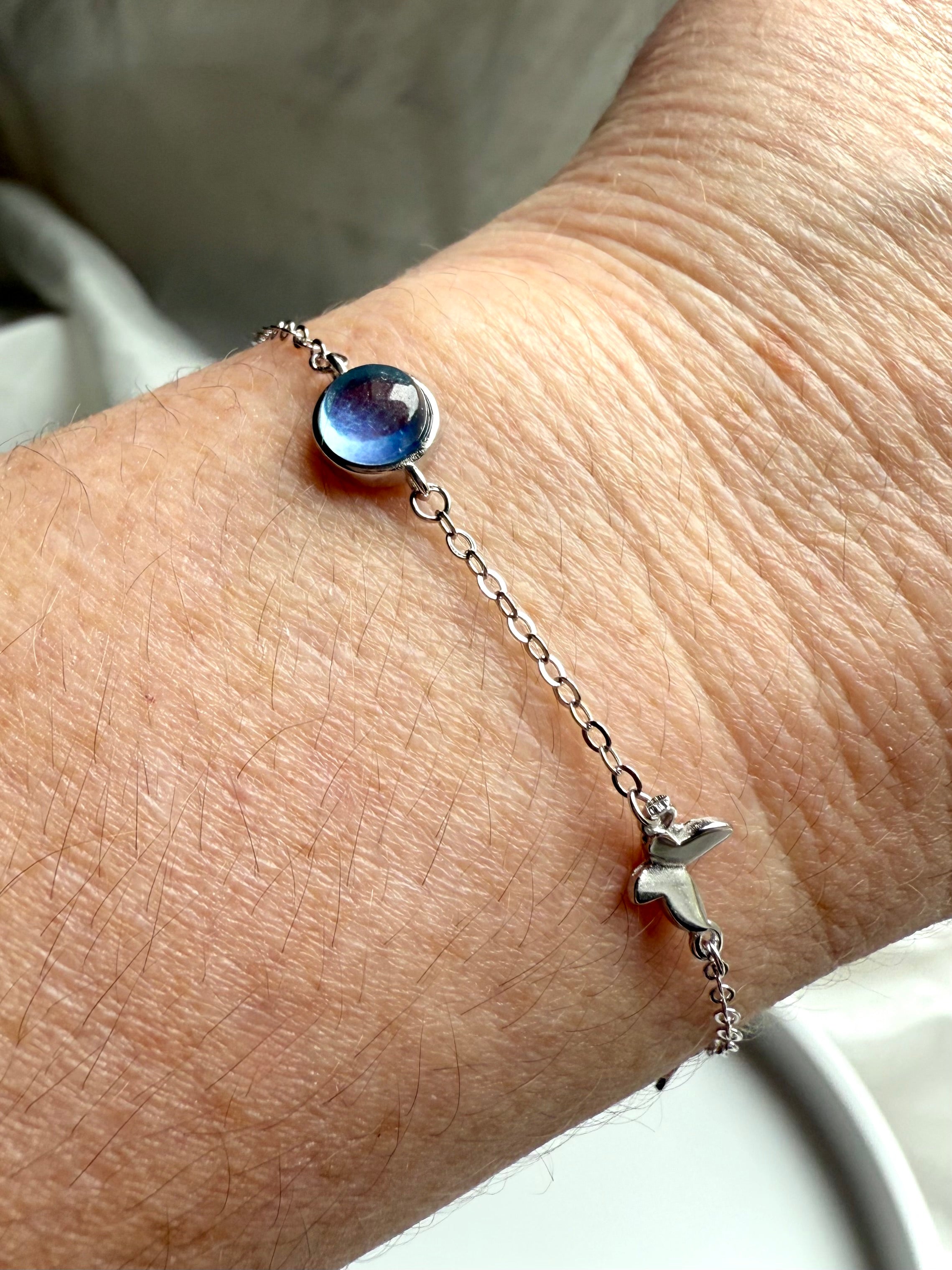 Sterling silver aquamarine butterfly bracelet with blue gemstone centerpiece, dainty jewelry for clarity, peace, and gift giving