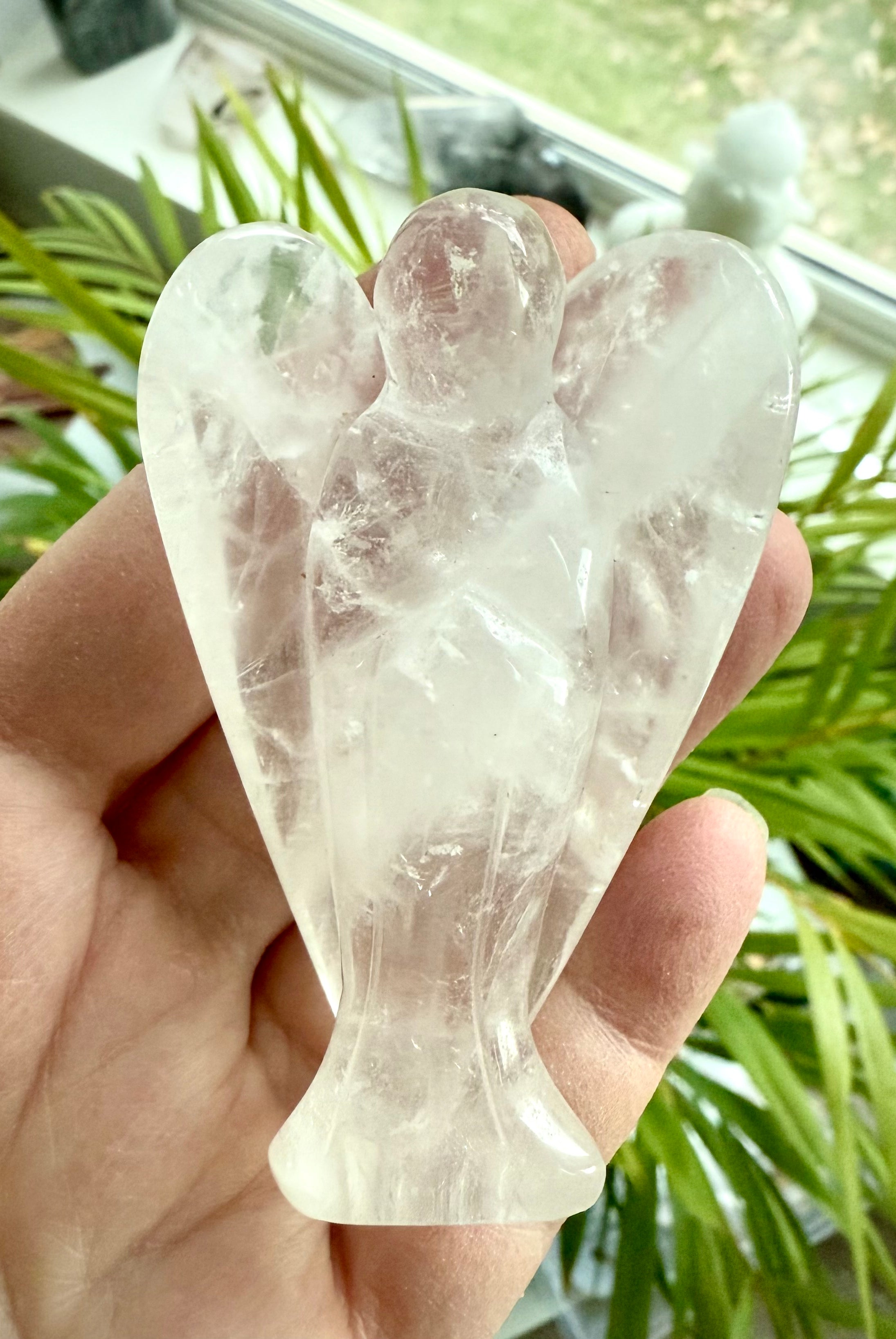 This luminous quartz crystal angel figurine brings a nurturing, protective energy to your space