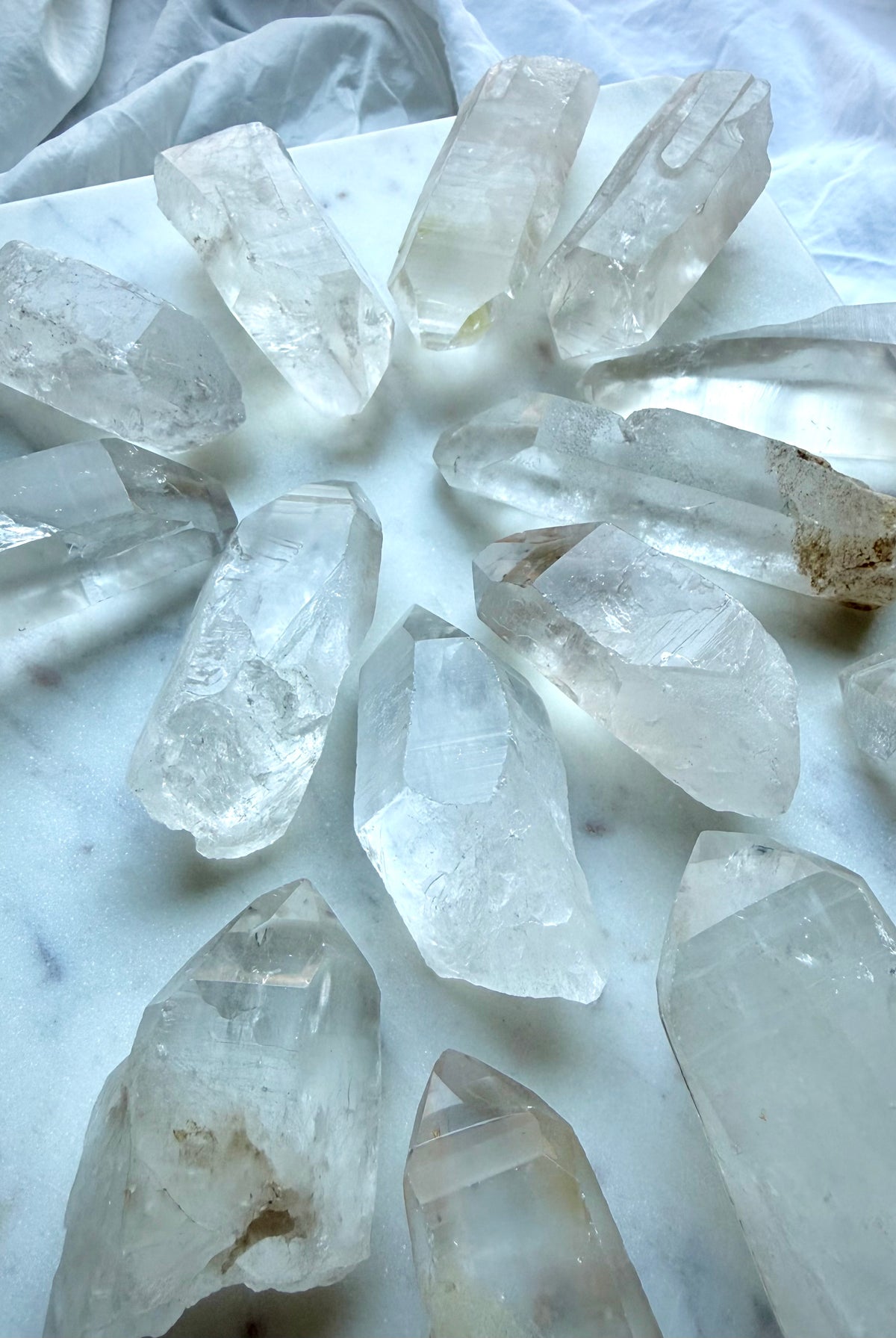 Chunky Lemurian Quartz points with varied natural terminations, rough surfaces, Clear Quartz, and cloudy mineral inclusions