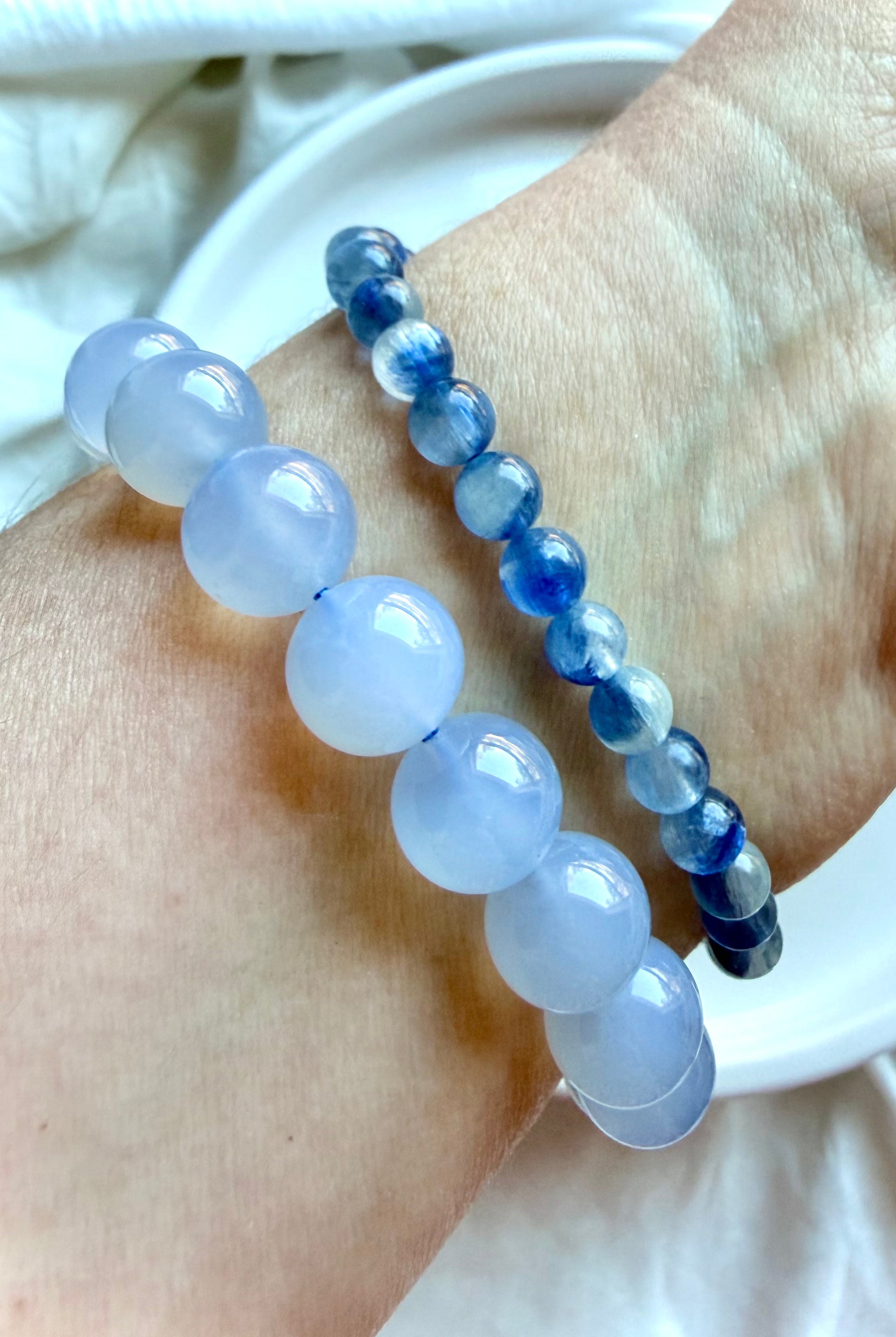 Blue Kyanite bracelet worn stacked with Blue Chalcedony bracelet for a calming crystal jewelry combination
