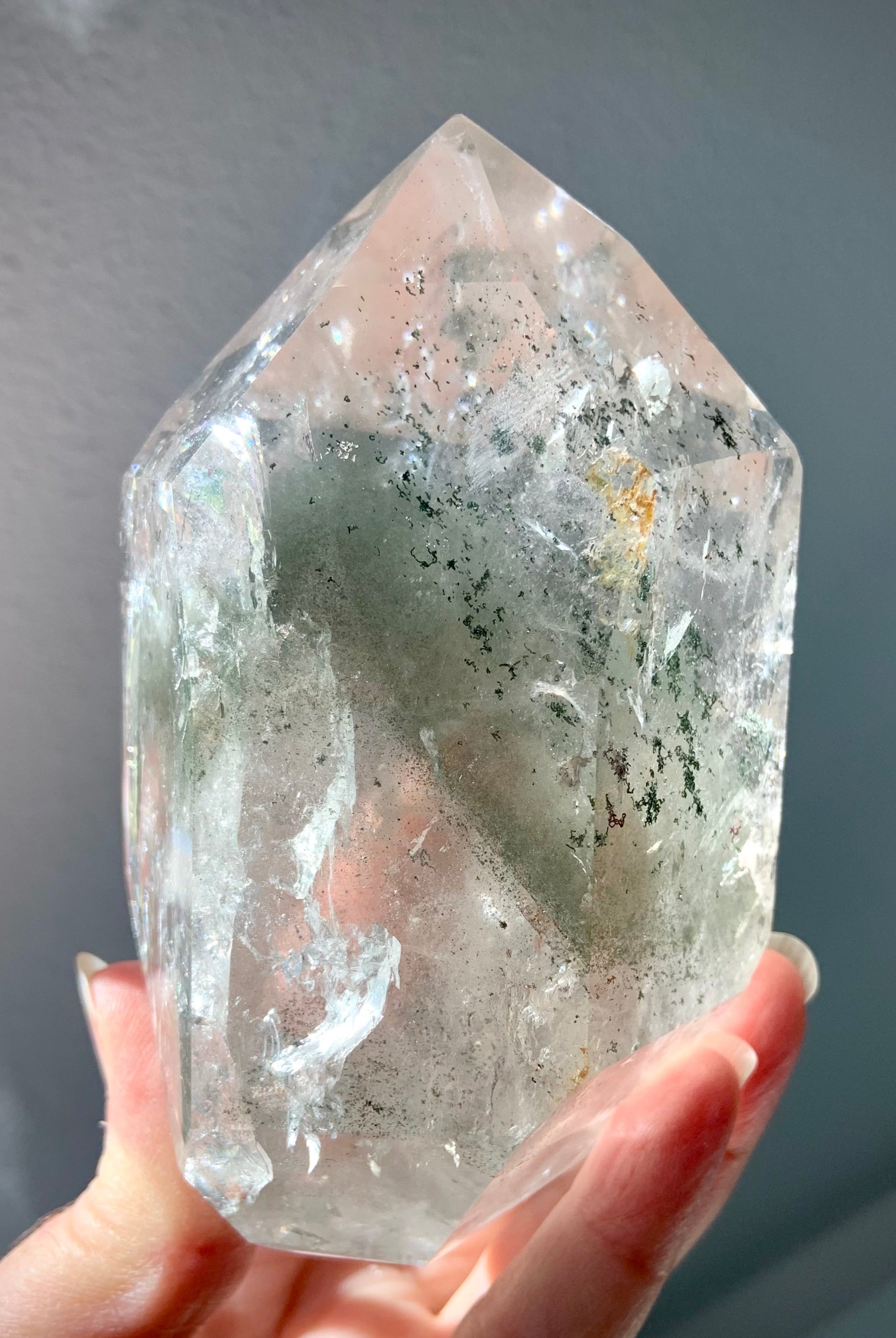 This Garden Quartz Crystal Tower has chlorite phantoms, mossy mineral inclusions + tons of rainbows