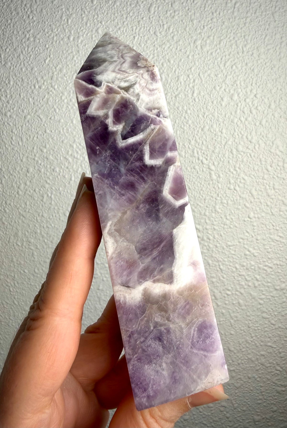 Dream Amethyst tower with dramatic purple and white Chevron Amethyst patterns, polished crystal point for spiritual protection and mental clarity