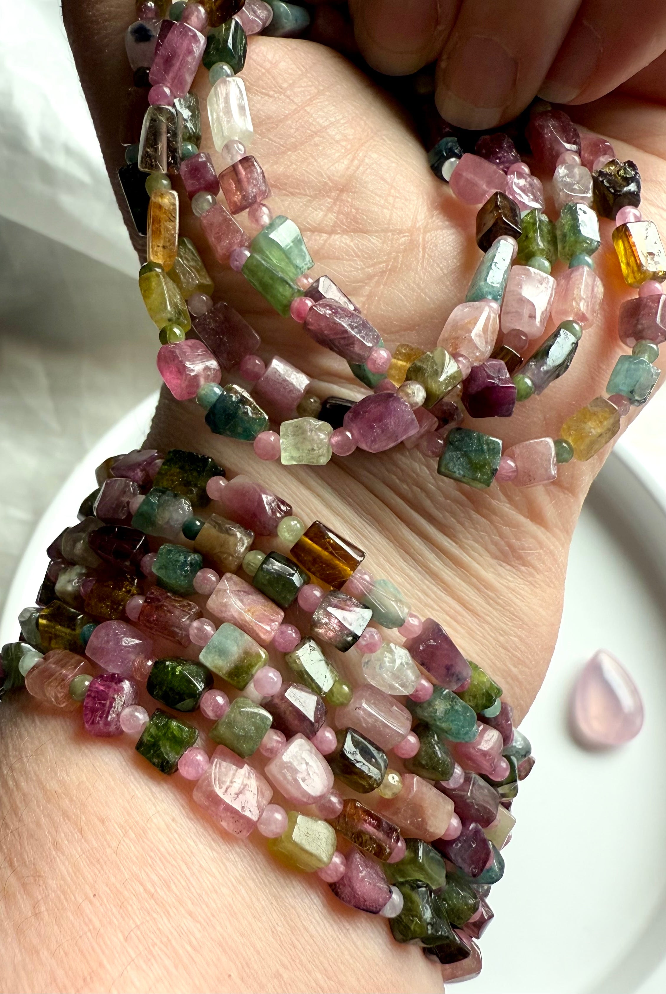 Wear your Rainbow Tourmaline bracelet to open the heart chakra with inspiration + compassion