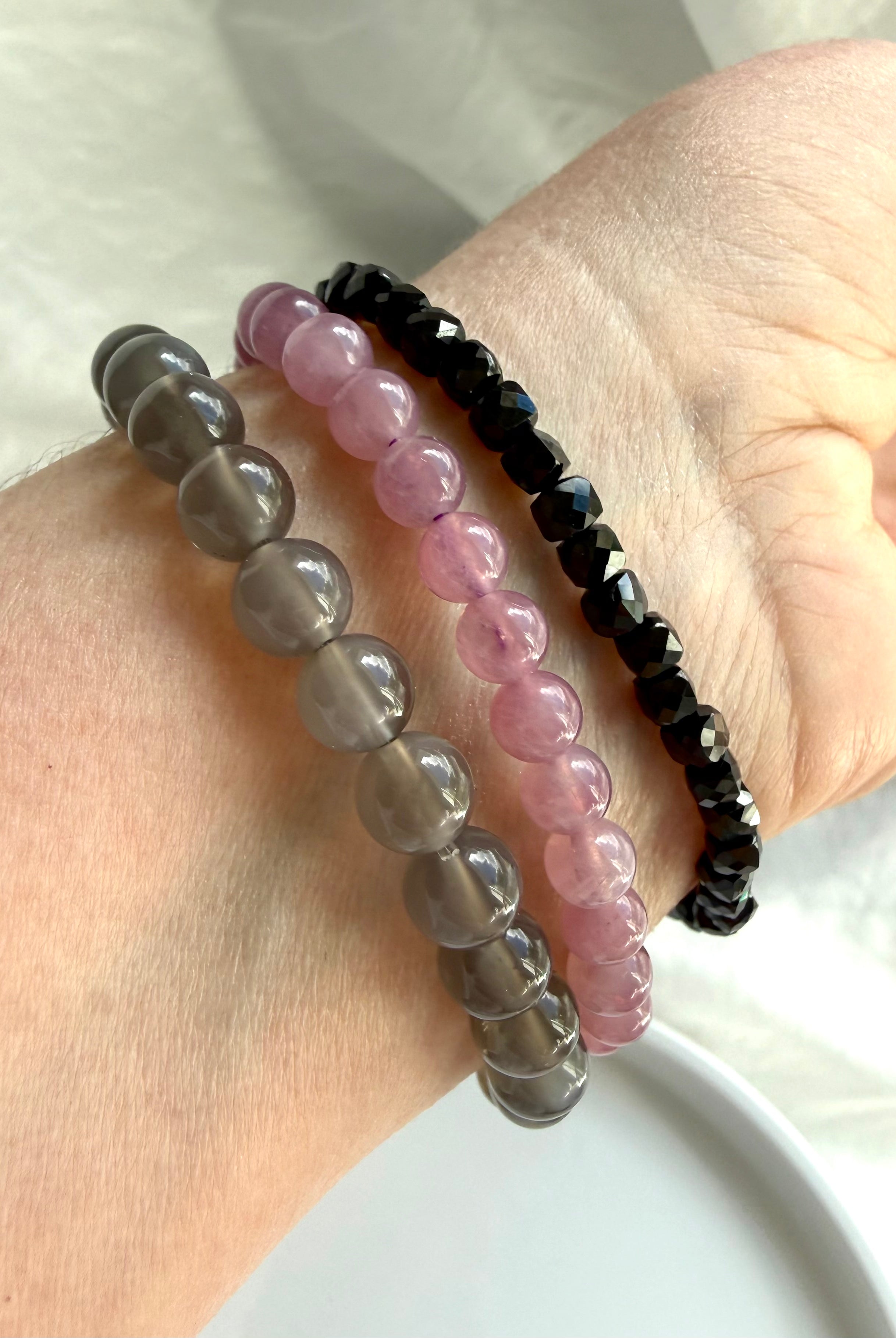Black Moonstone bracelet layered with Lavender Rose Quartz and Black Spinel crystal bracelets