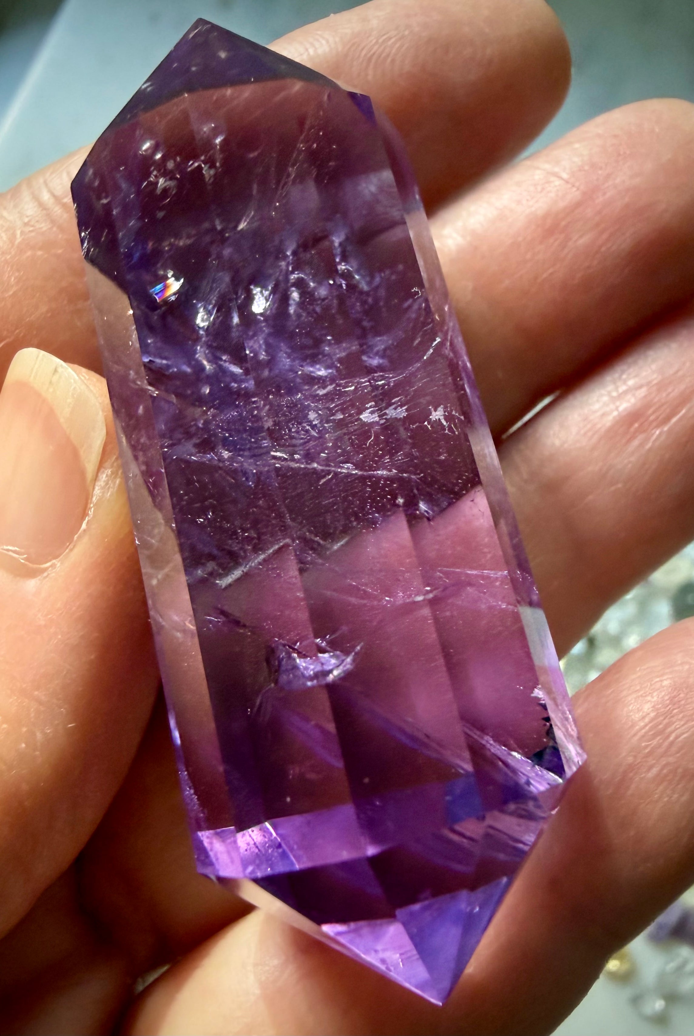 One-of-a-kind Vogel cut Amethyst crystal with luminous violet hues and interior rainbows