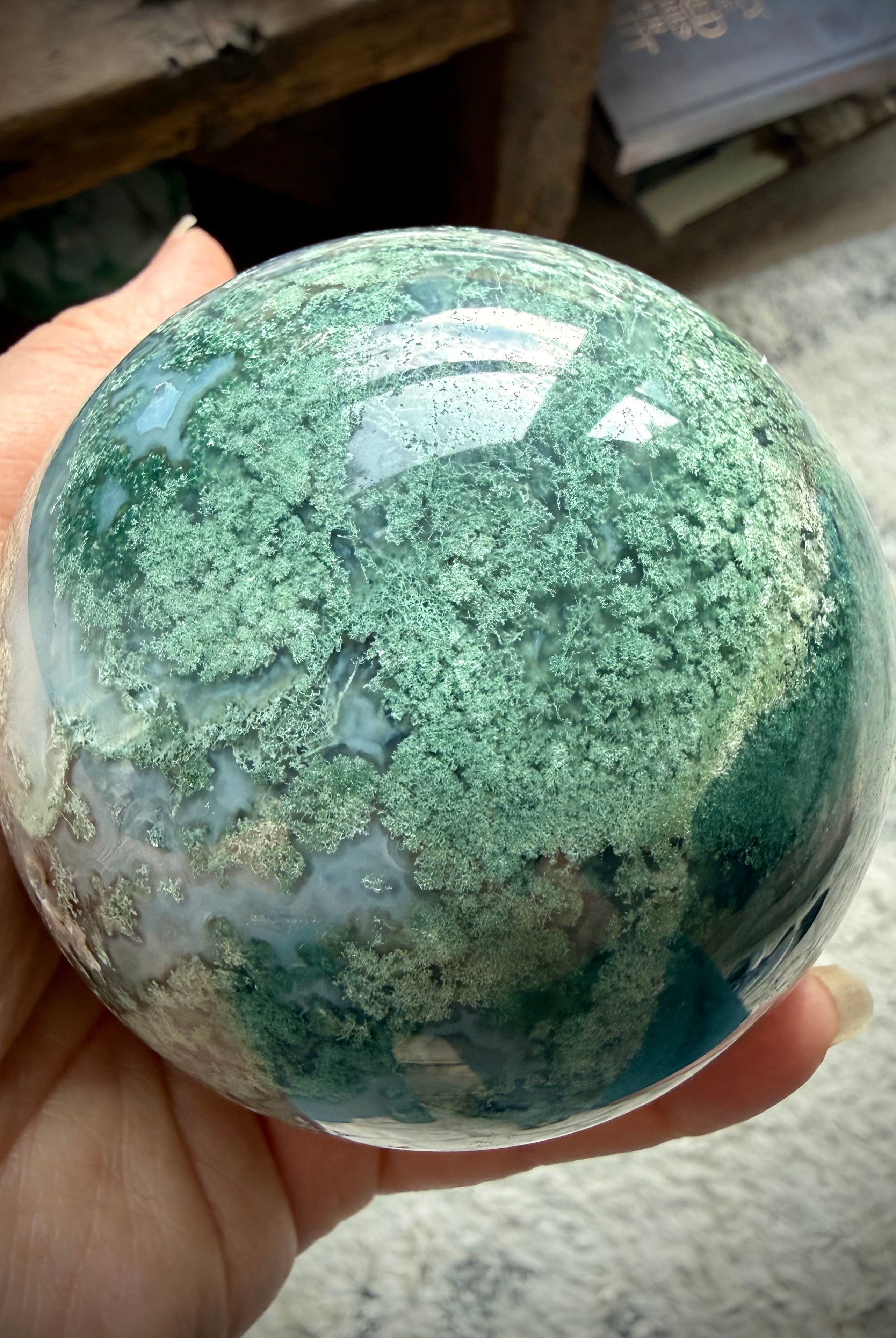 Lacy Moss Agate sphere with stand featuring natural Quartz details and one of a kind crystal patterns