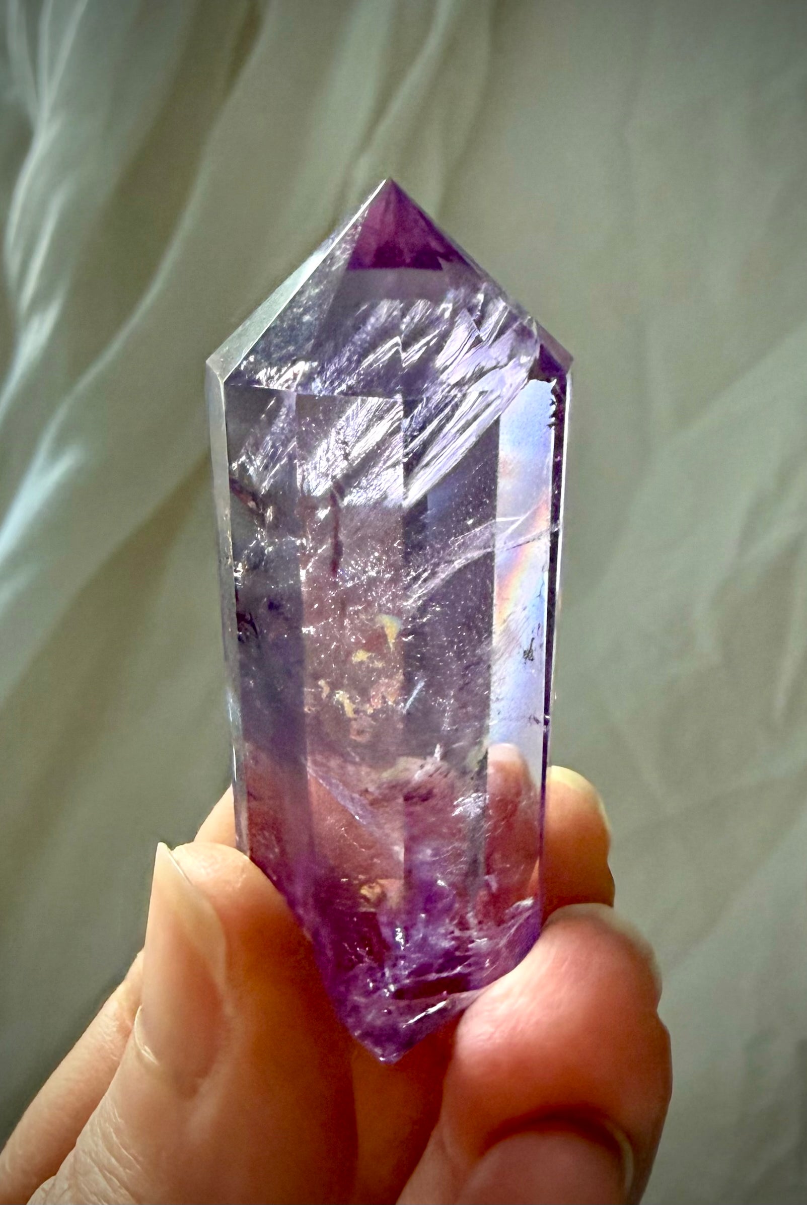 Precision faceted Amethyst Vogel cut crystal wand with beautiful internal veils and dimensional purple tones