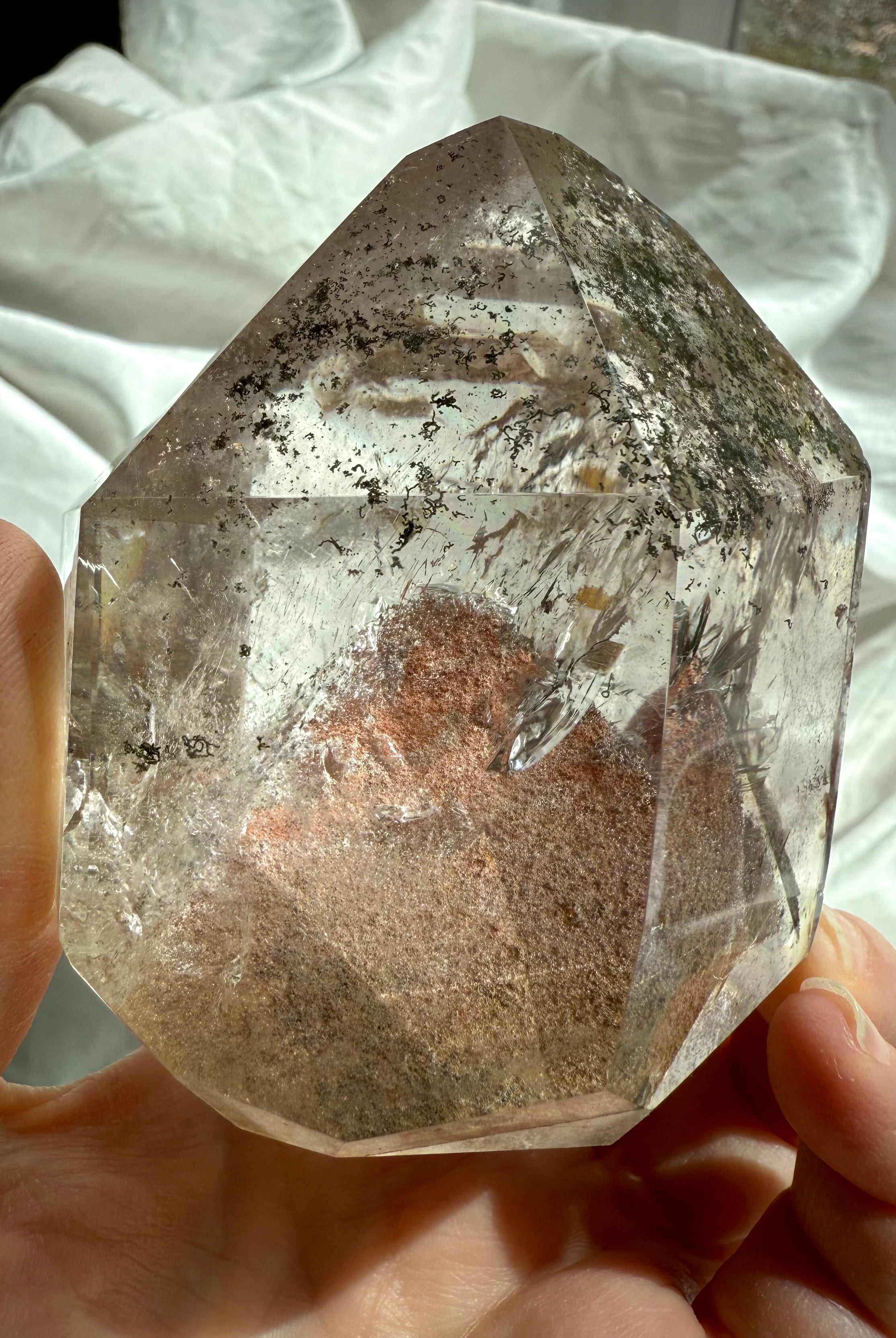 This Lodolite Garden Quartz Tower has a big reddish orange pyramid phantom, plus lots rainbows