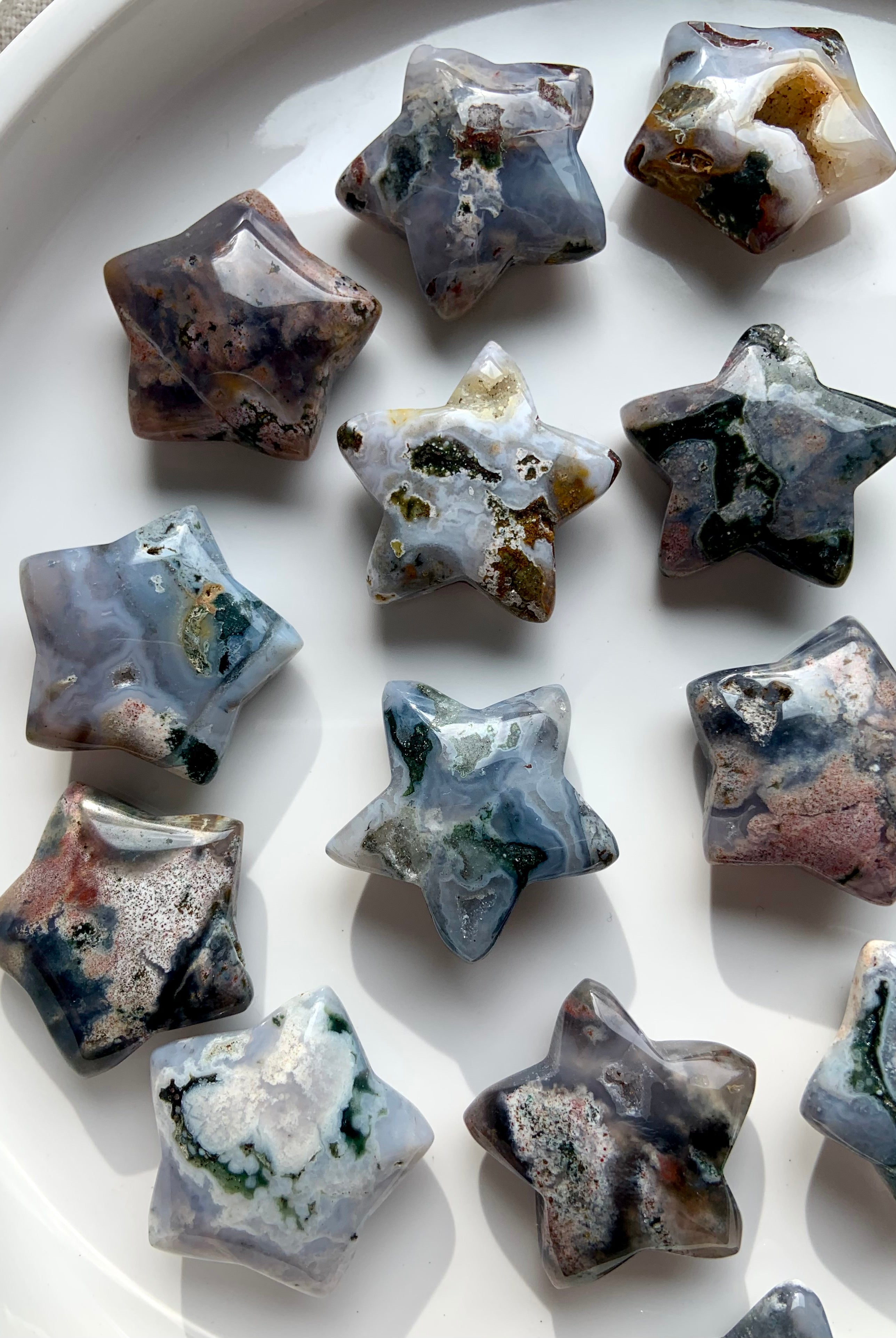 Cosmic Ocean Jasper star carvings on white background