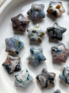Cosmic Ocean Jasper star carvings on white background
