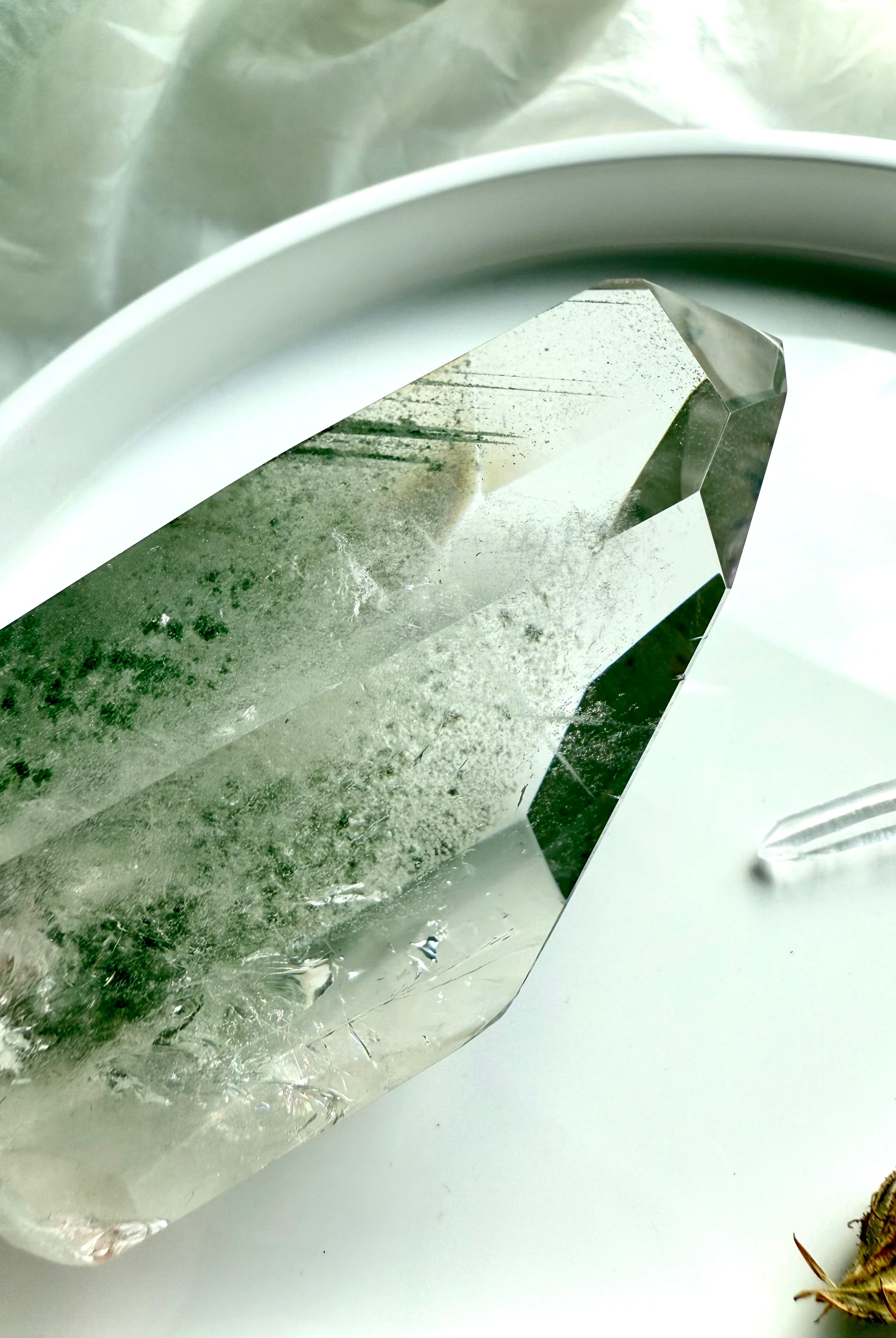 Side view of Garden Quartz Crystal tower with lush green chlorite phantom inclusions, silvery flash